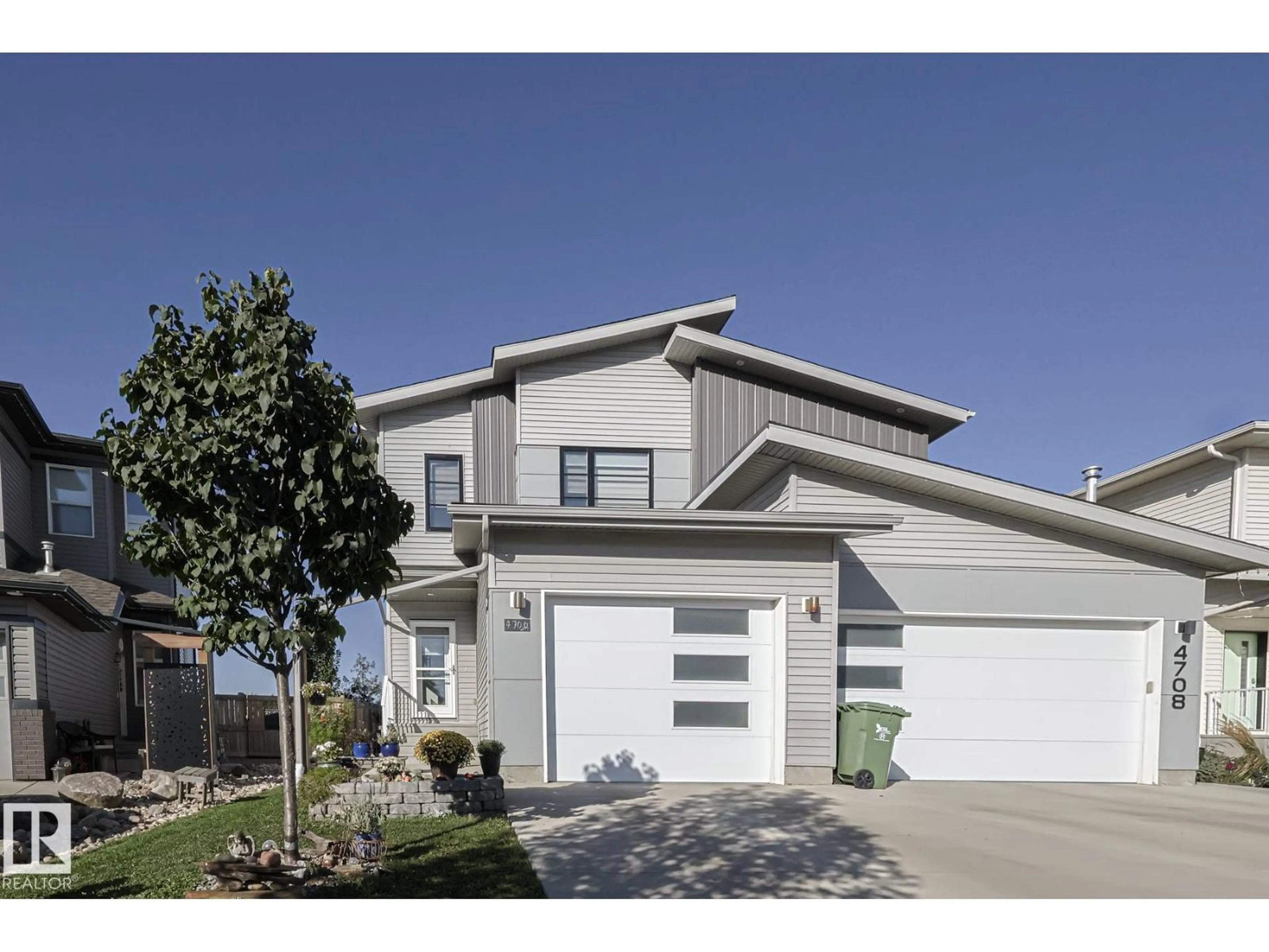 Home with vinyl exterior material, street for 4706 67 ST, Beaumont Alberta T4X1Z9