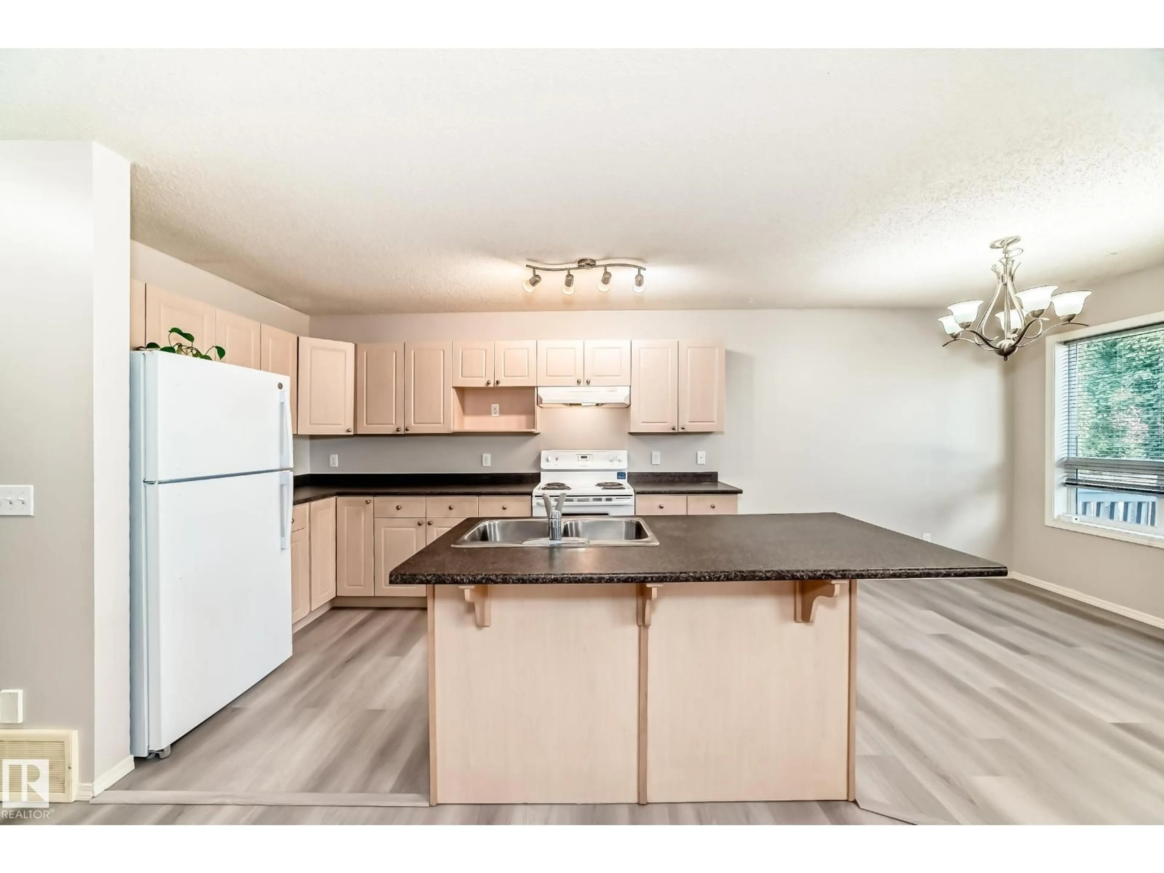 Open concept kitchen, wood/laminate floor for 11 GRAYWOOD TC, Stony Plain Alberta T7Z0A6