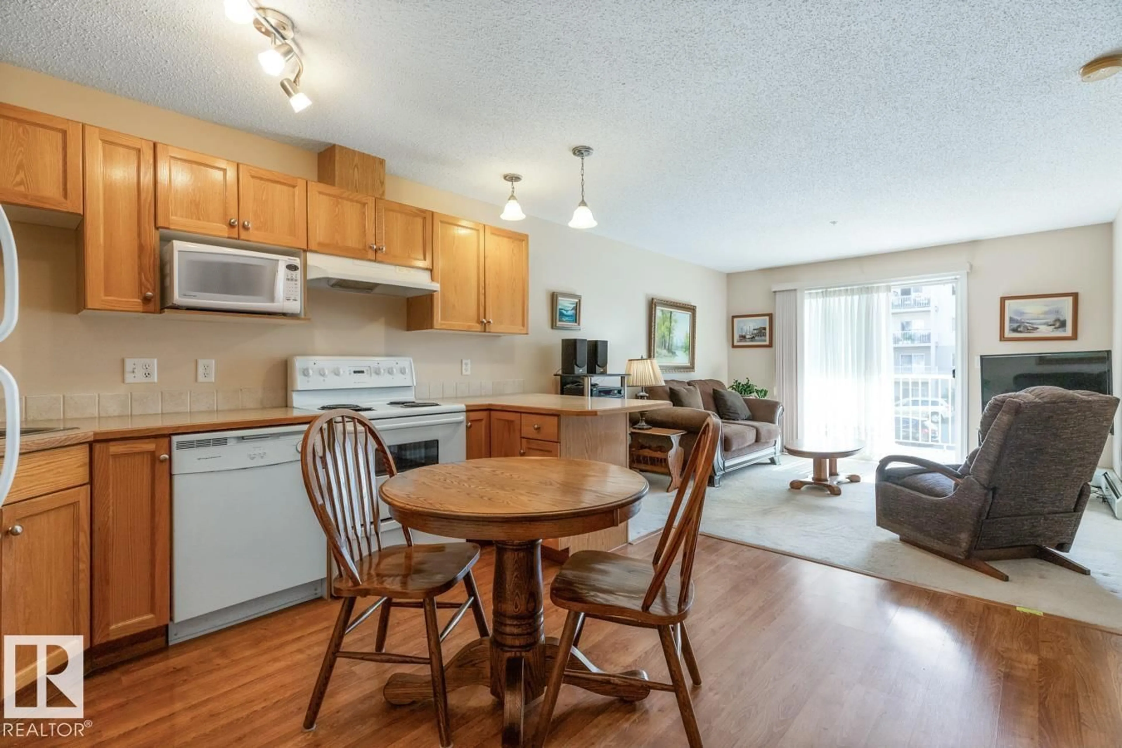 Open concept kitchen, wood/laminate floor for 205 - 7511 171 ST, Edmonton Alberta T5T6S7