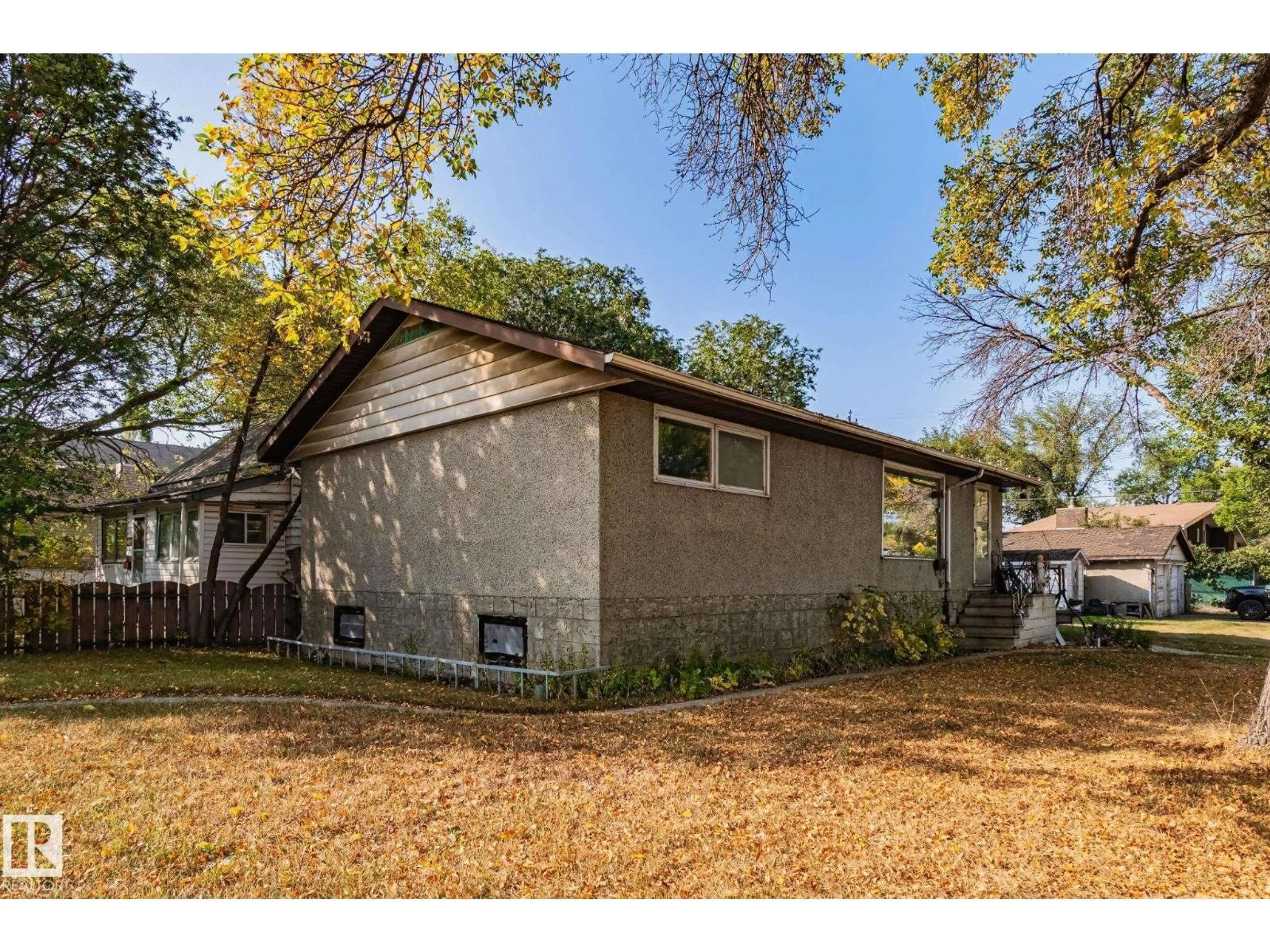 Home with vinyl exterior material, street for NW - 12350 82 ST, Edmonton Alberta T5B2X2