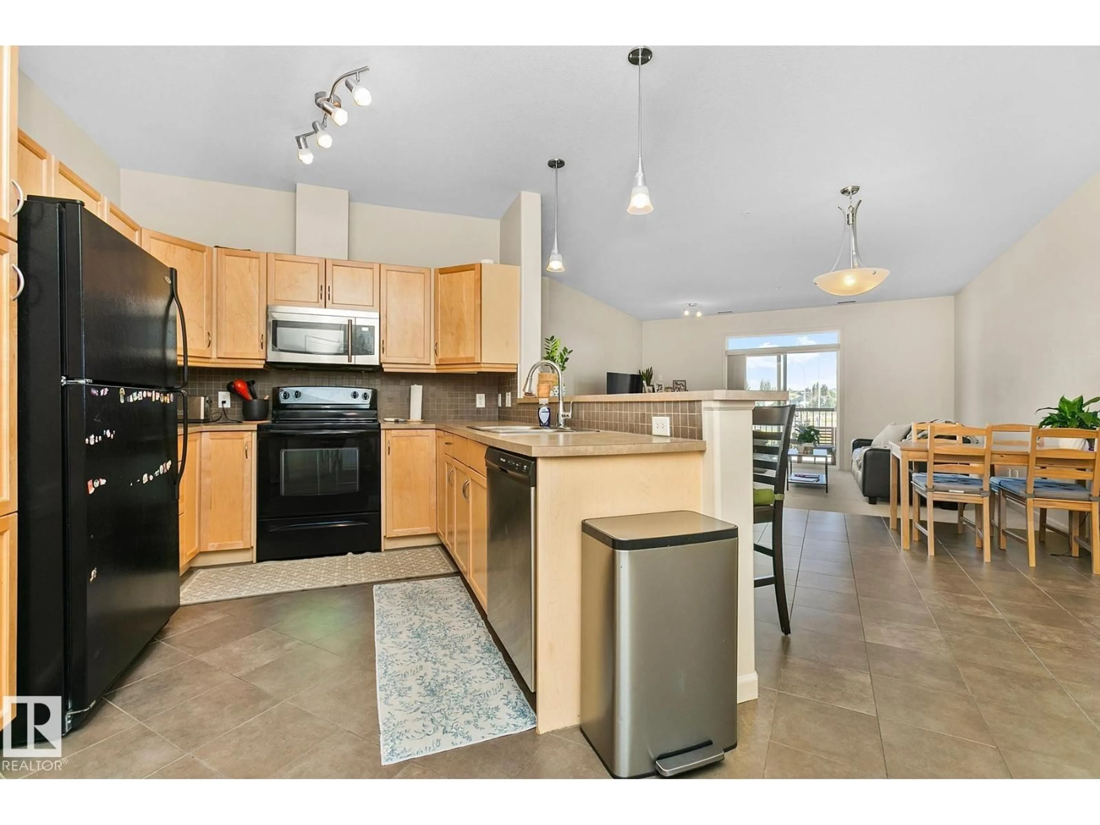 Open concept kitchen, unknown for #212 - 2503 HANNA CR, Edmonton Alberta T6R0H3
