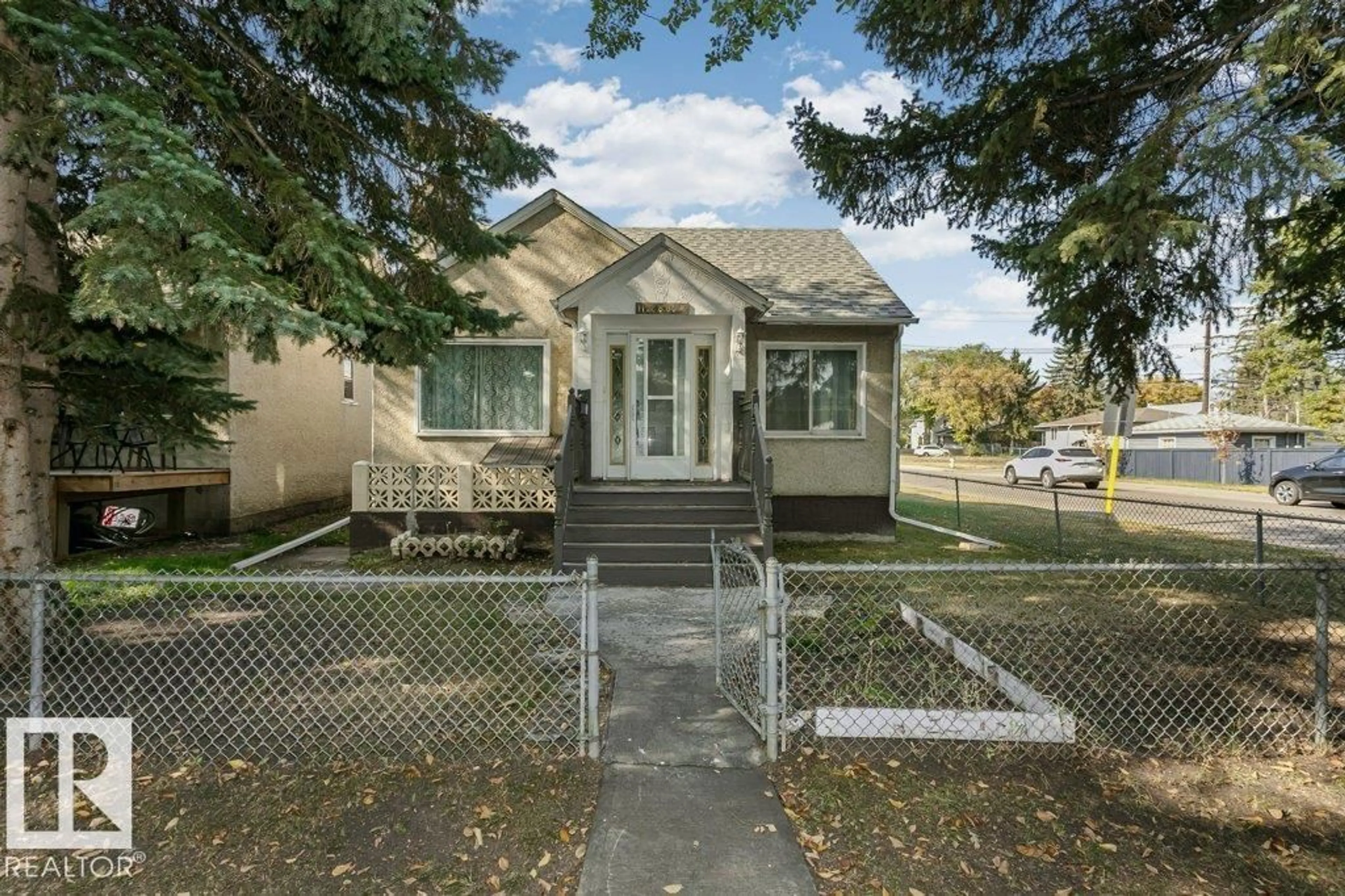 Home with vinyl exterior material, street for 11248 85 ST, Edmonton Alberta T5B3C7