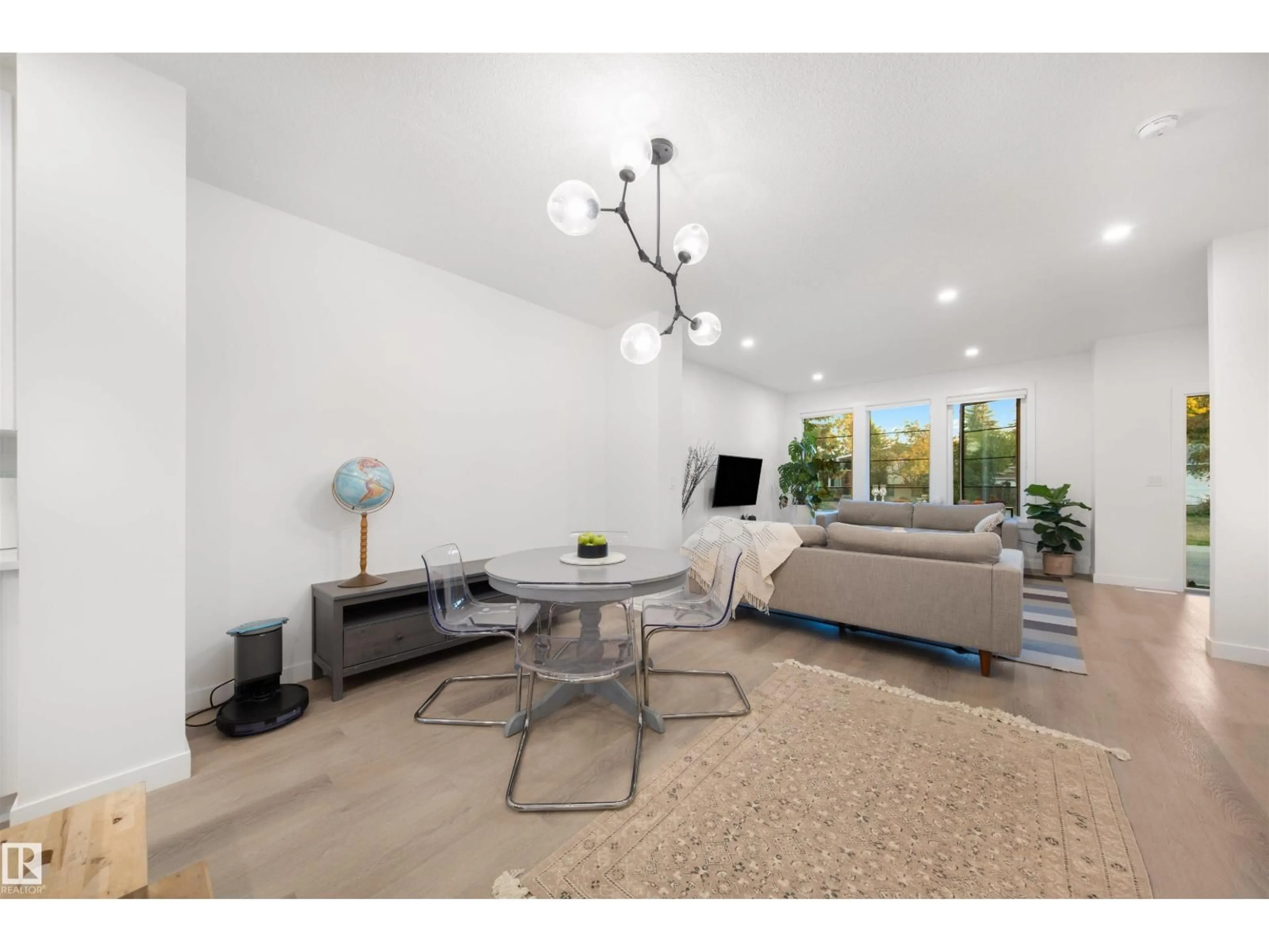 Living room with furniture, unknown for NW - 11204 & 11206 55 AV, Edmonton Alberta T6H0X1