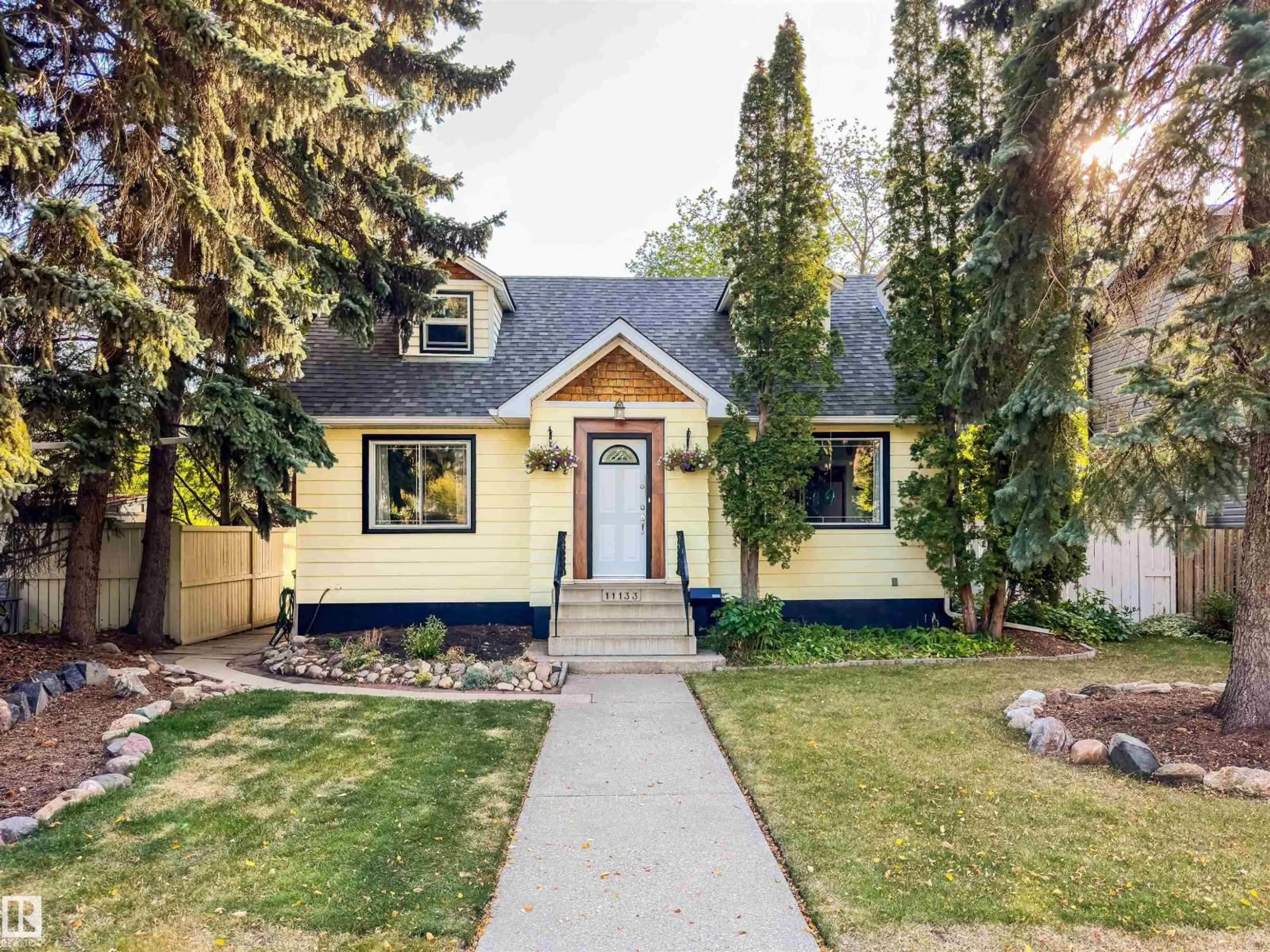Home with vinyl exterior material, street for NW - 11133 57 ST, Edmonton Alberta T5W3T7