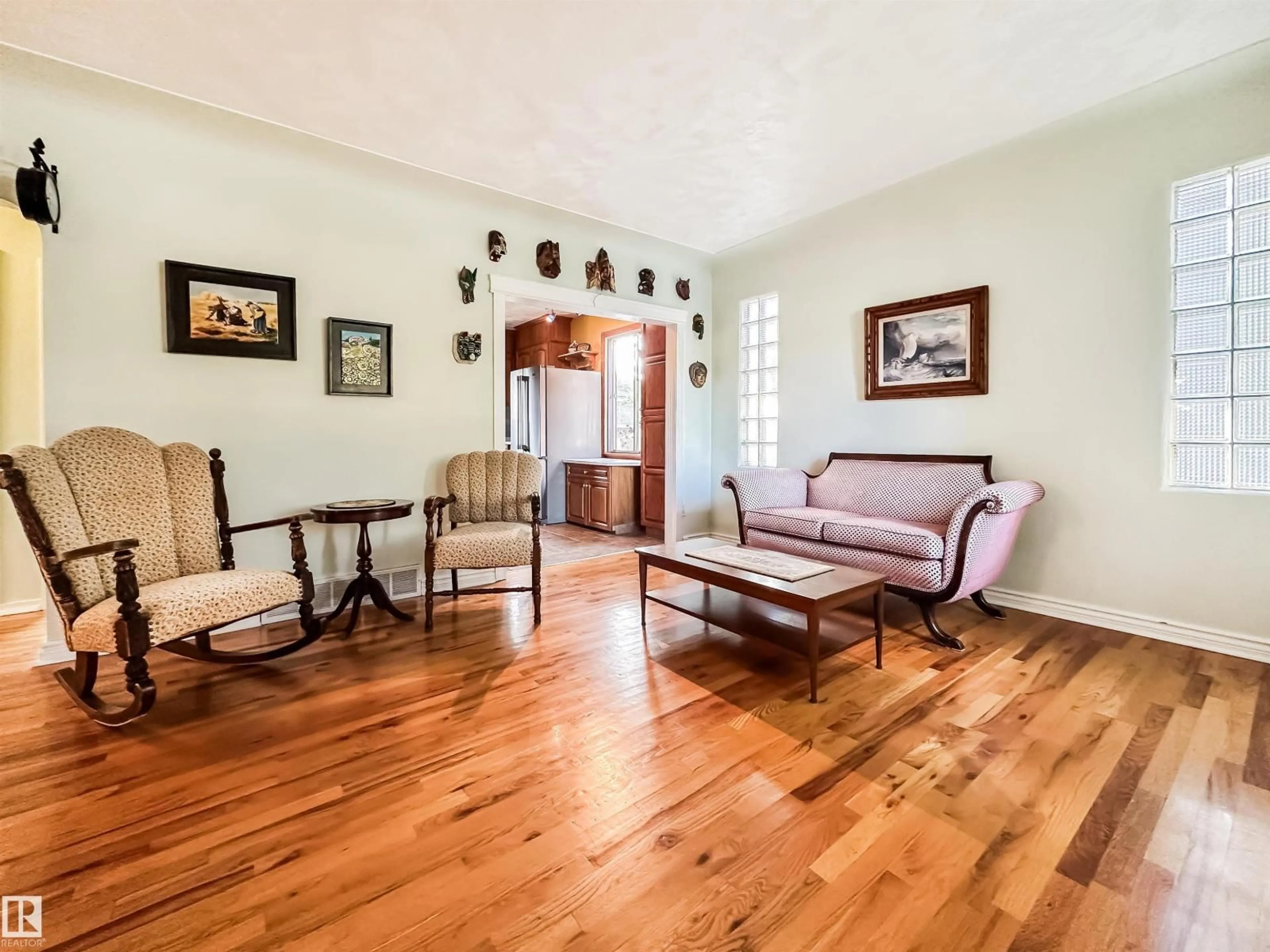 Living room with furniture, wood/laminate floor for NW - 11133 57 ST, Edmonton Alberta T5W3T7