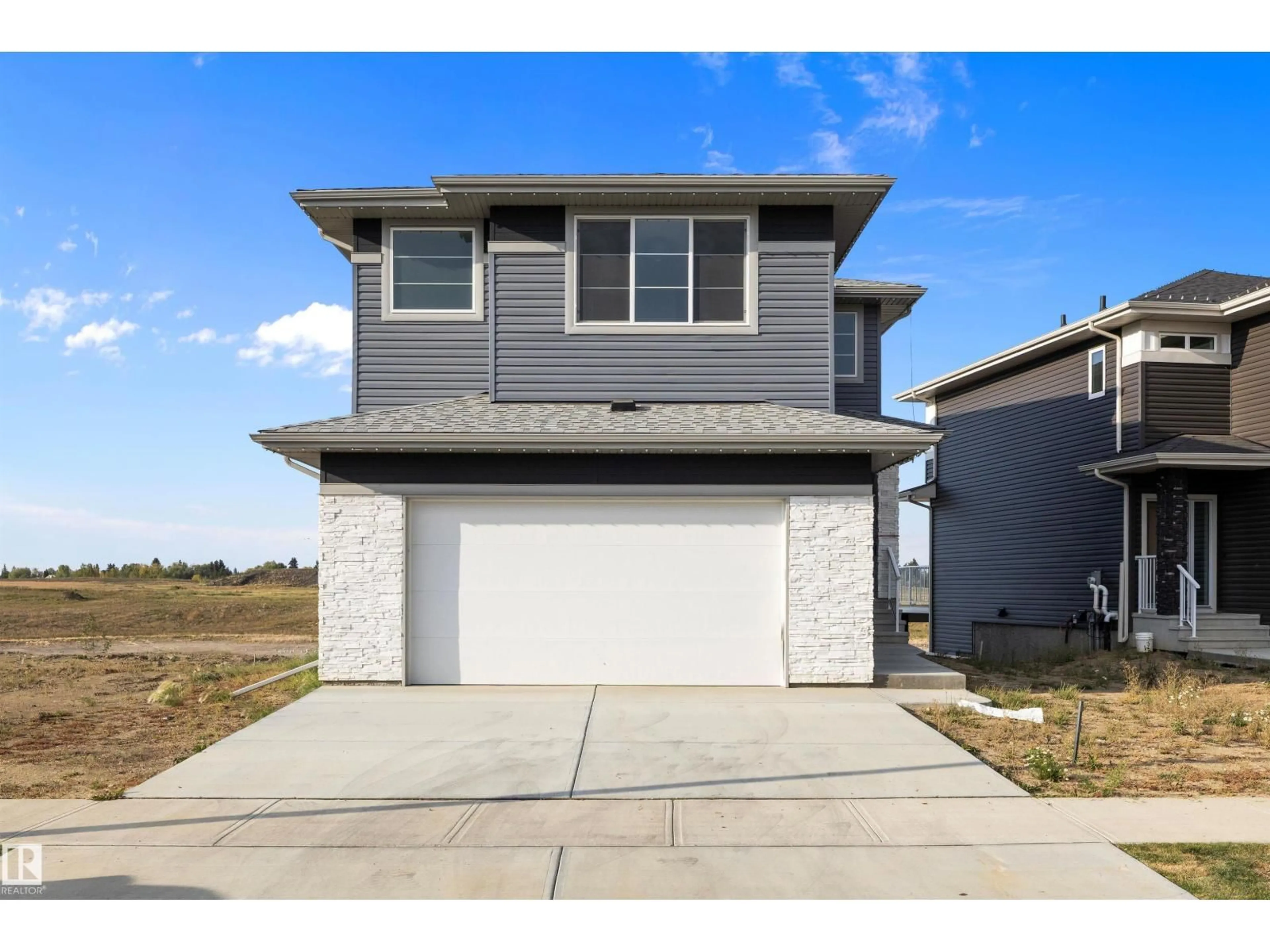 Home with vinyl exterior material, street for 10238 92A AV, Morinville Alberta T8R2R4