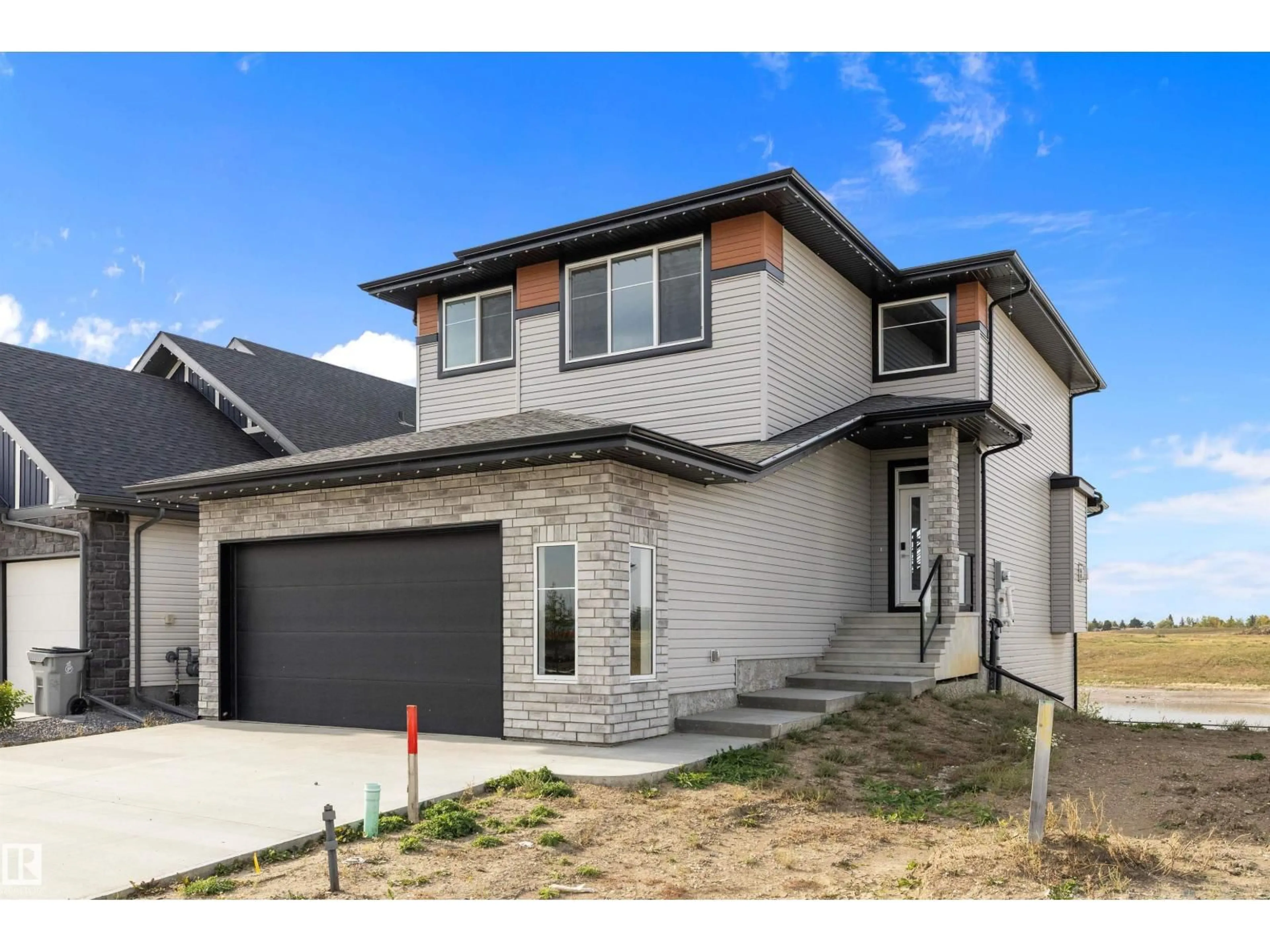 Home with brick exterior material, street for 10214 92A AV, Morinville Alberta T8R2R4