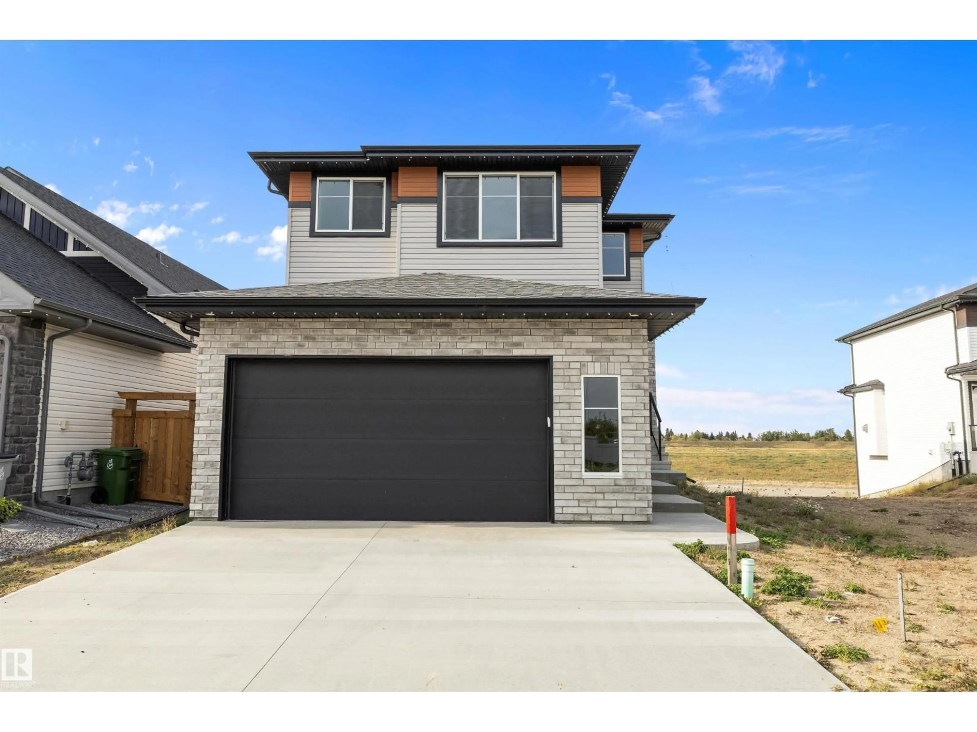 Home with brick exterior material, street for 10214 92A AV, Morinville Alberta T8R2R4
