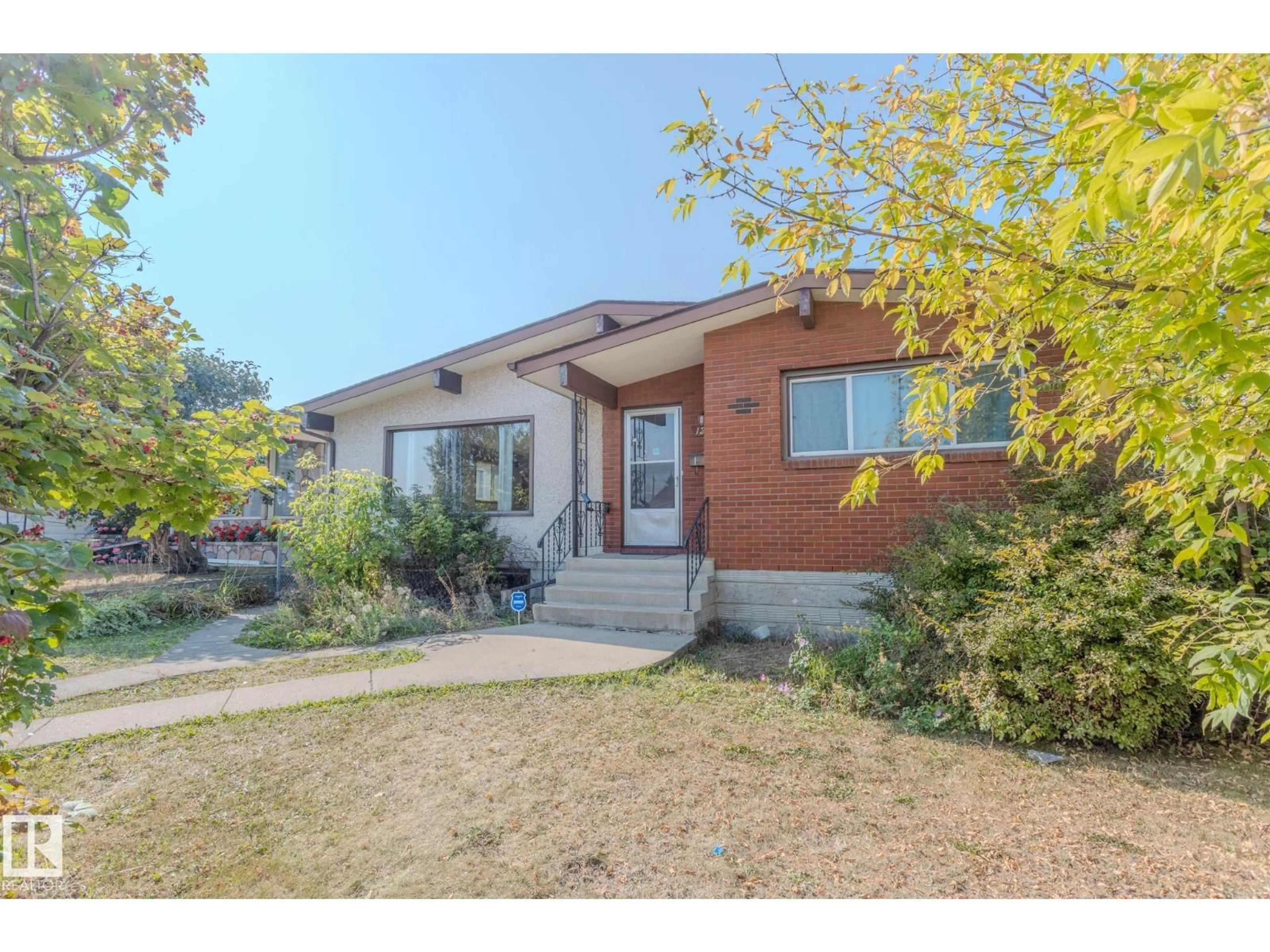 Home with brick exterior material, street for NW - 12920 87 ST, Edmonton Alberta T5E3E1