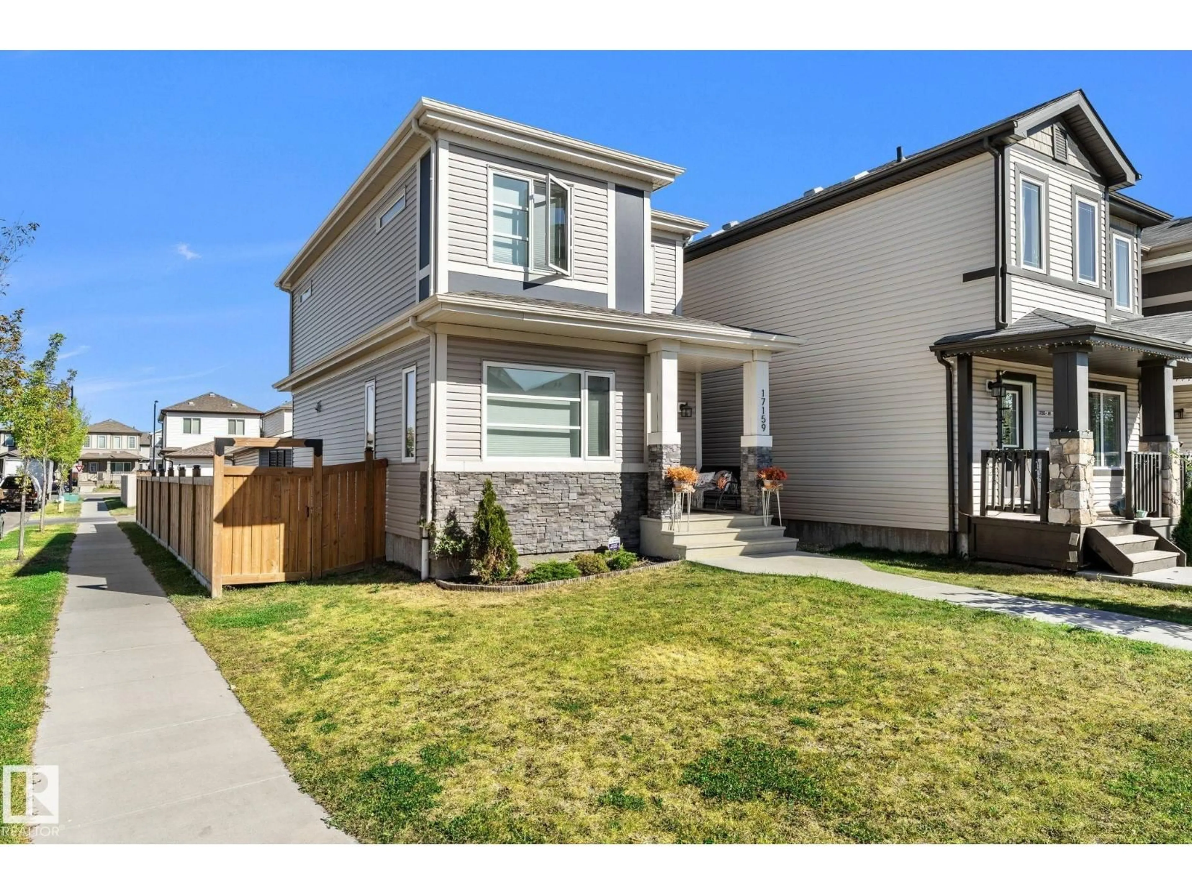 Home with vinyl exterior material, street for 17159 49 ST, Edmonton Alberta T5Z0J1
