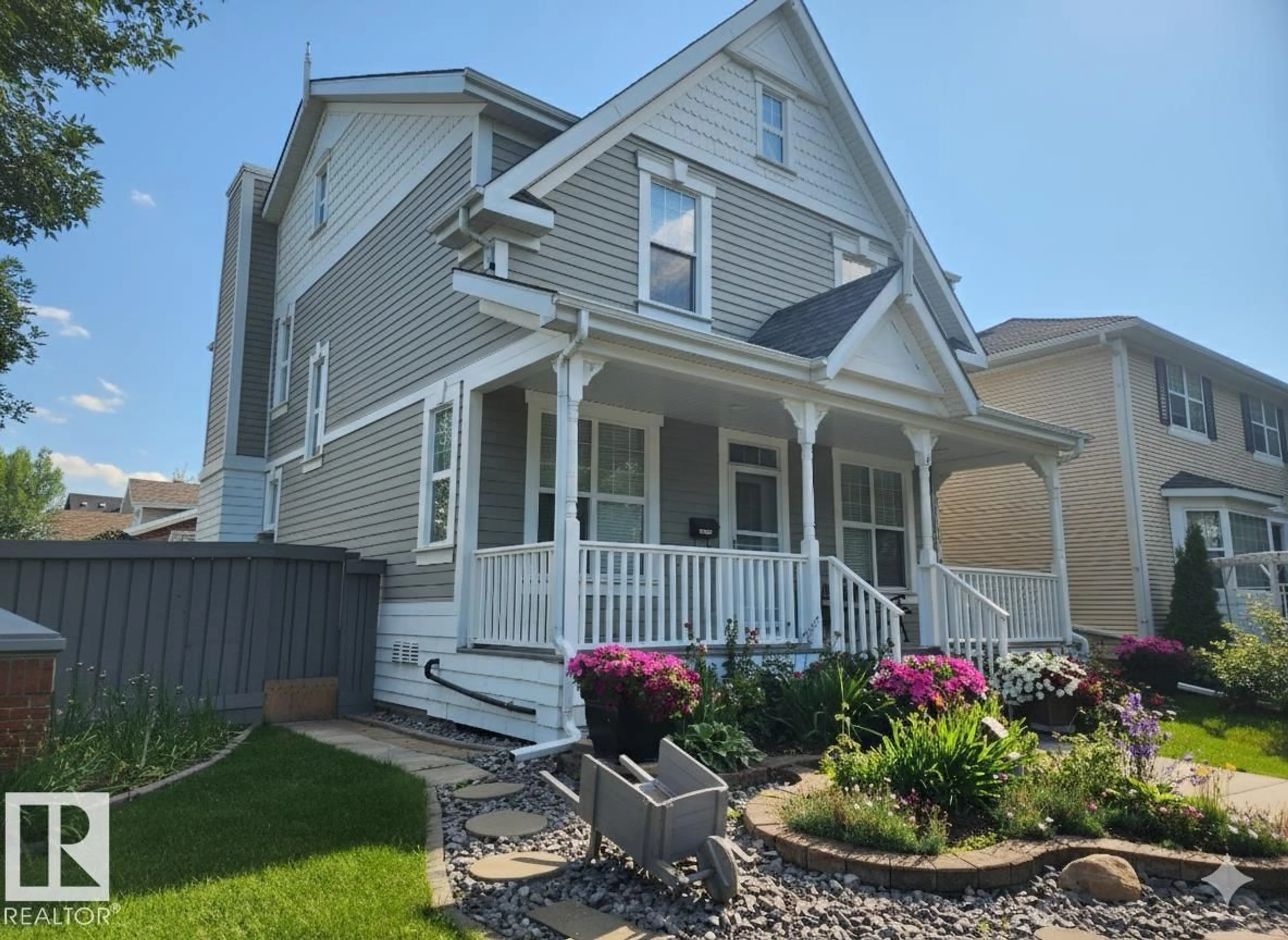 Home with vinyl exterior material, street for 129 GRIESBACH RD, Edmonton Alberta T5E6L9