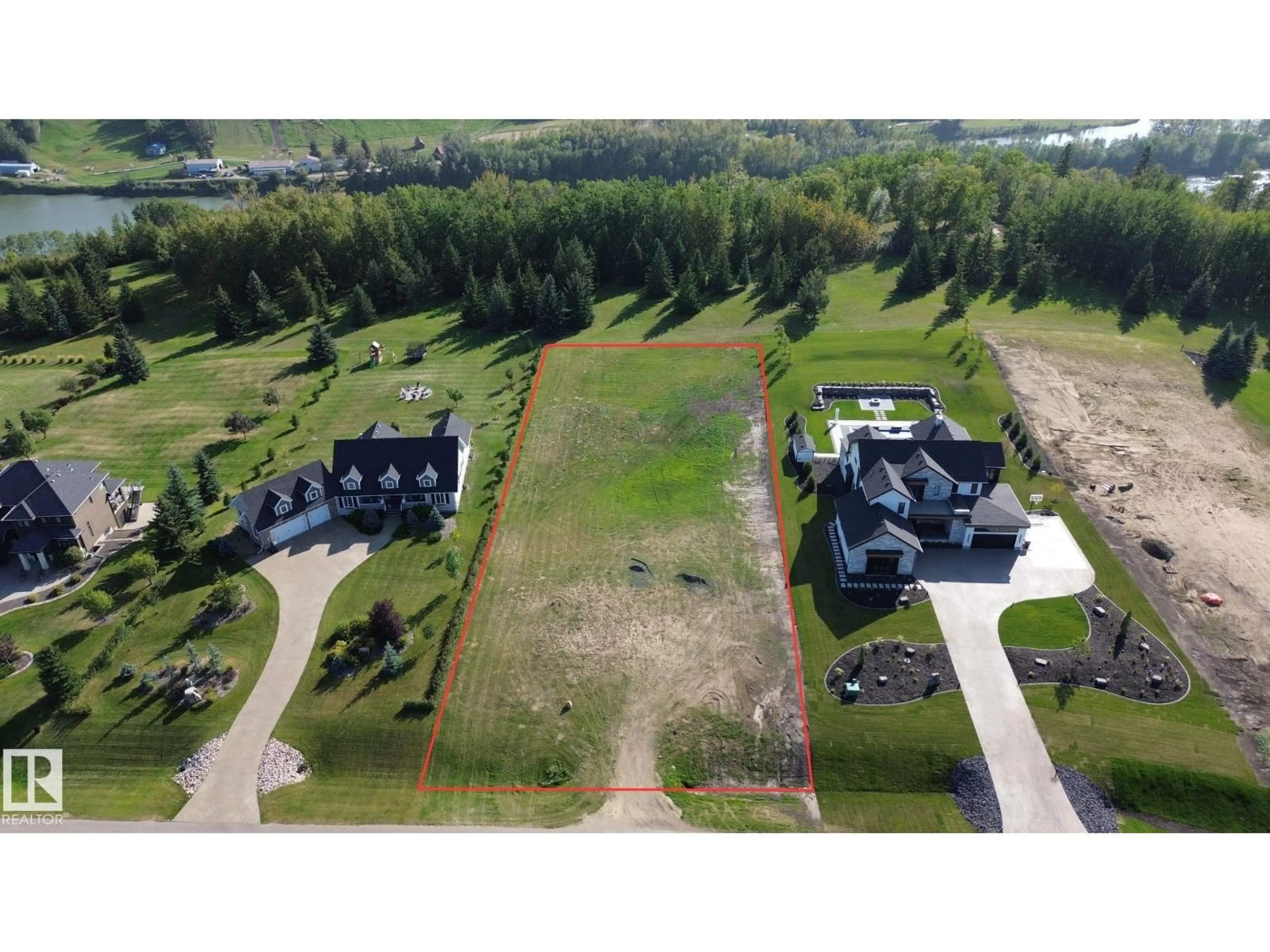 A pic from outside/outdoor area/front of a property/back of a property/a pic from drone, unknown for 17 - 25515 TWP RD 511 A, Rural Parkland County Alberta T7Y1A8