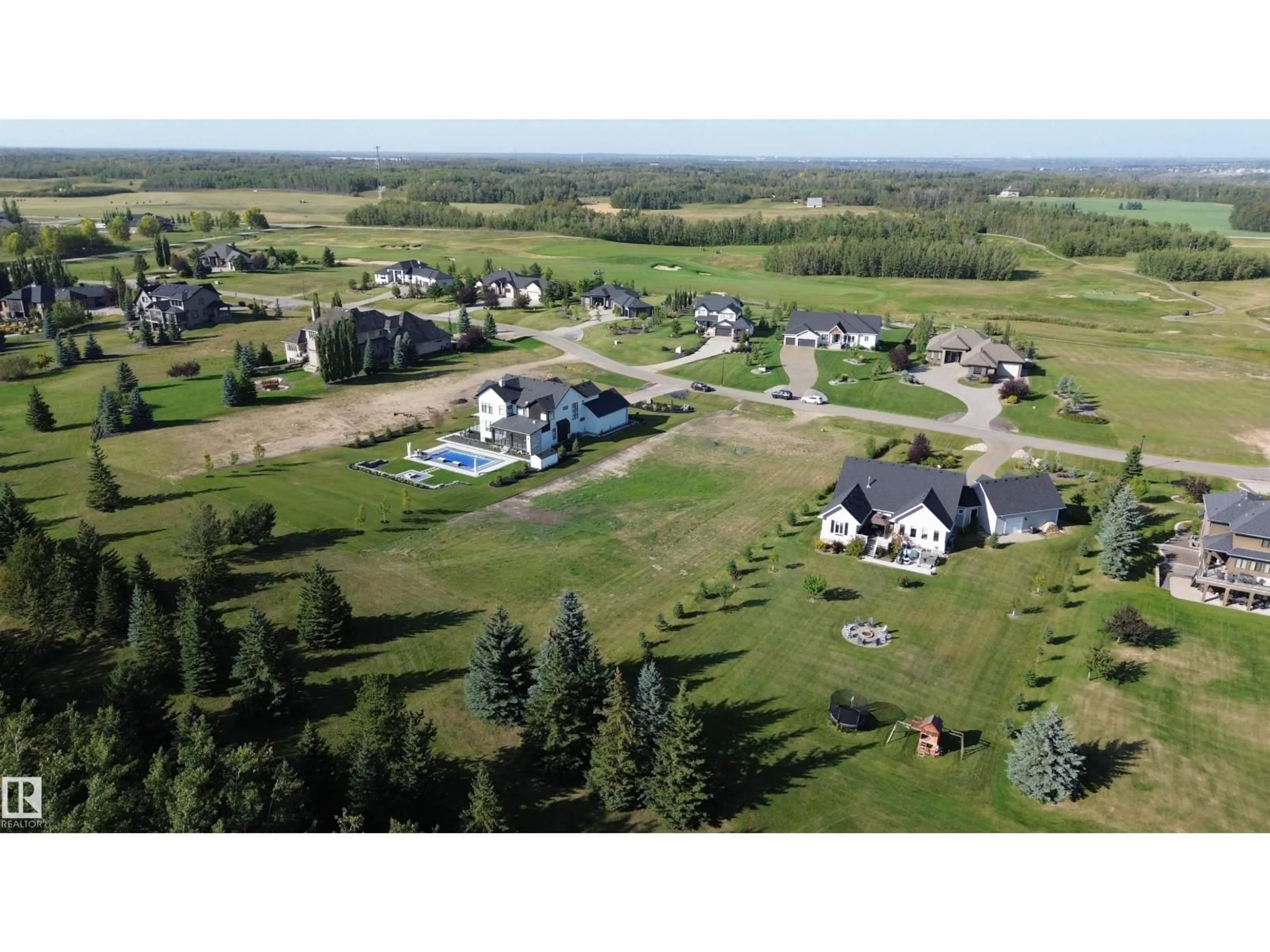 A pic from outside/outdoor area/front of a property/back of a property/a pic from drone, water/lake/river/ocean view for 17 - 25515 TWP RD 511 A, Rural Parkland County Alberta T7Y1A8