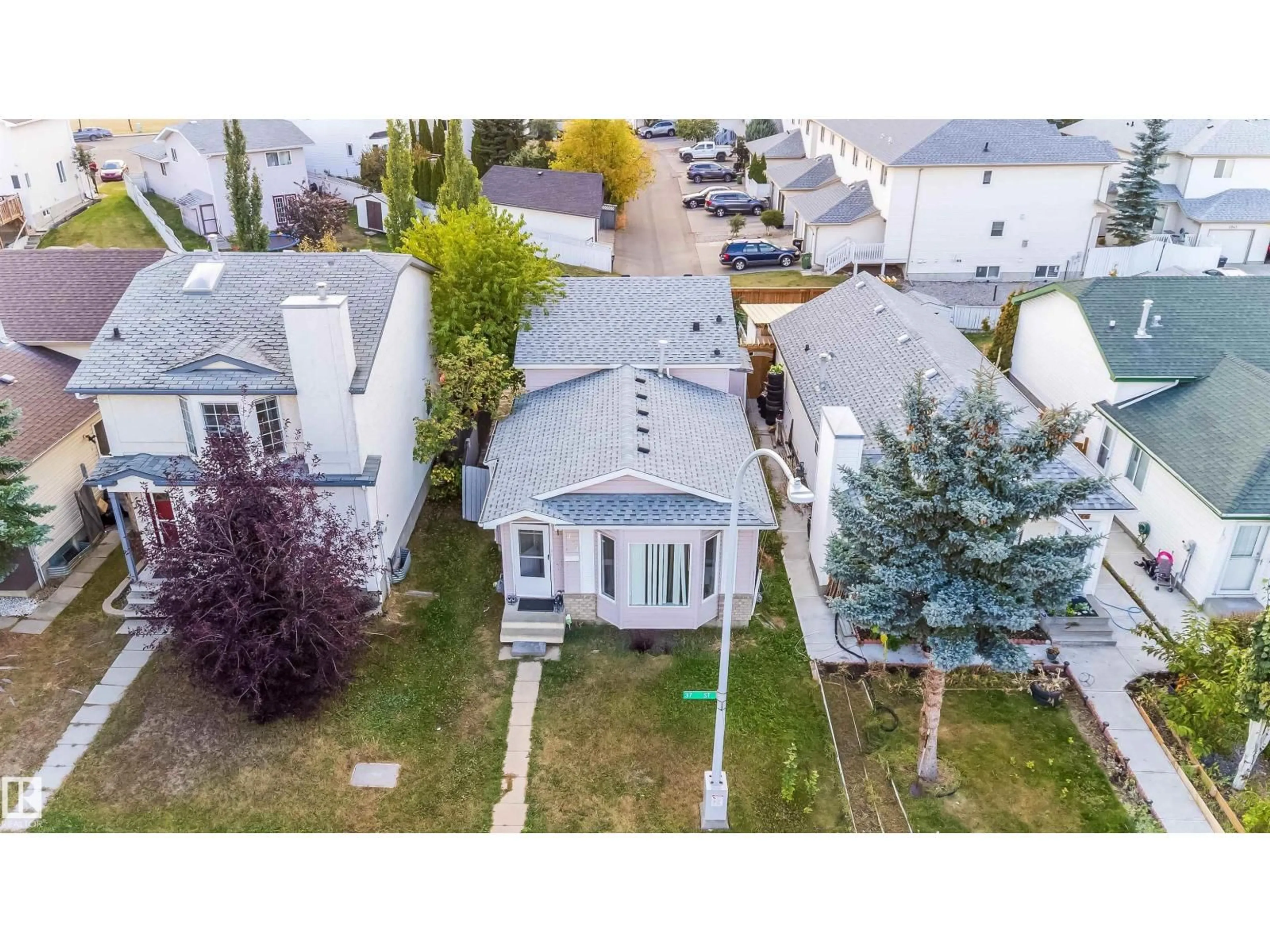 A pic from outside/outdoor area/front of a property/back of a property/a pic from drone, street for 4004 37 ST, Edmonton Alberta T6L6M8