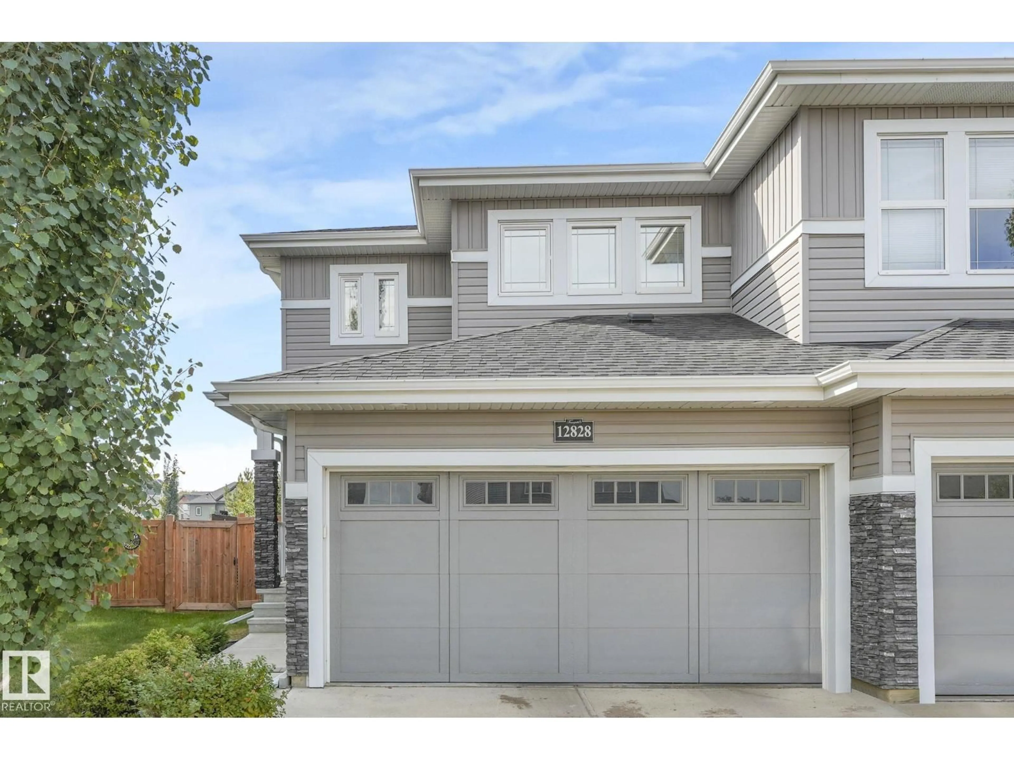 Home with vinyl exterior material, street for 12828 207 ST, Edmonton Alberta T5S0G4