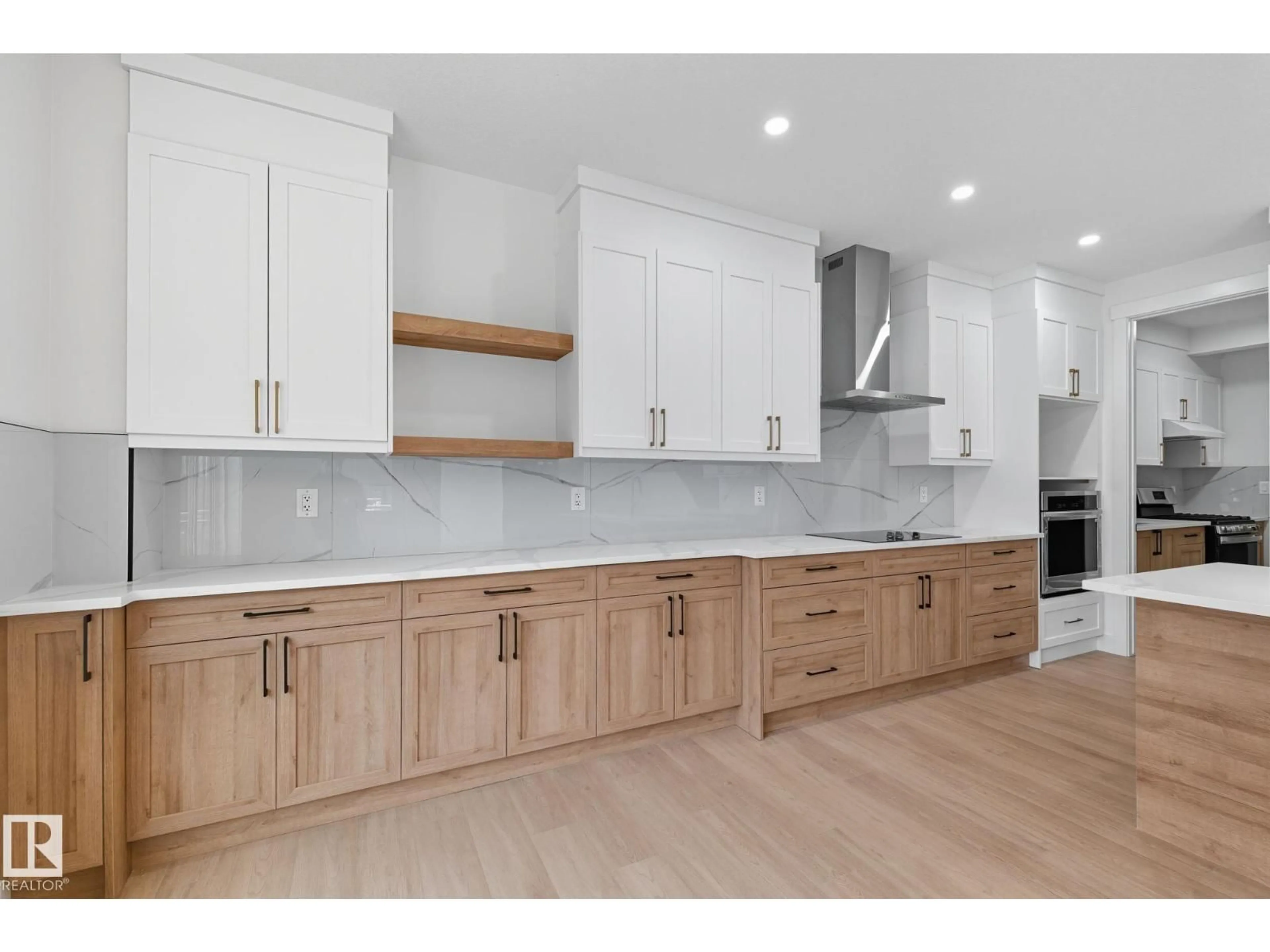 Open concept kitchen, wood/laminate floor for 1133 GYRFALCON CR, Edmonton Alberta T5S0S5