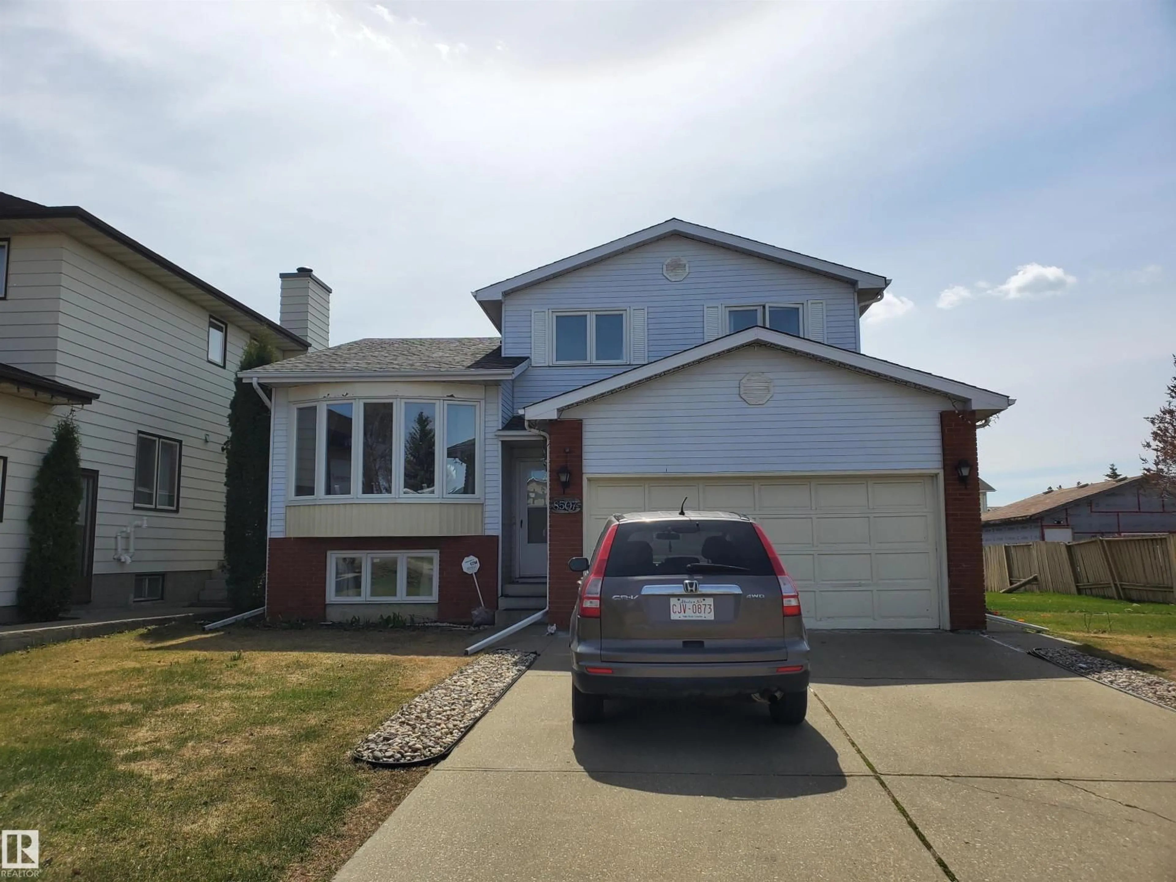 Home with vinyl exterior material, street for NW - 8507 152B AV, Edmonton Alberta T5E5V7