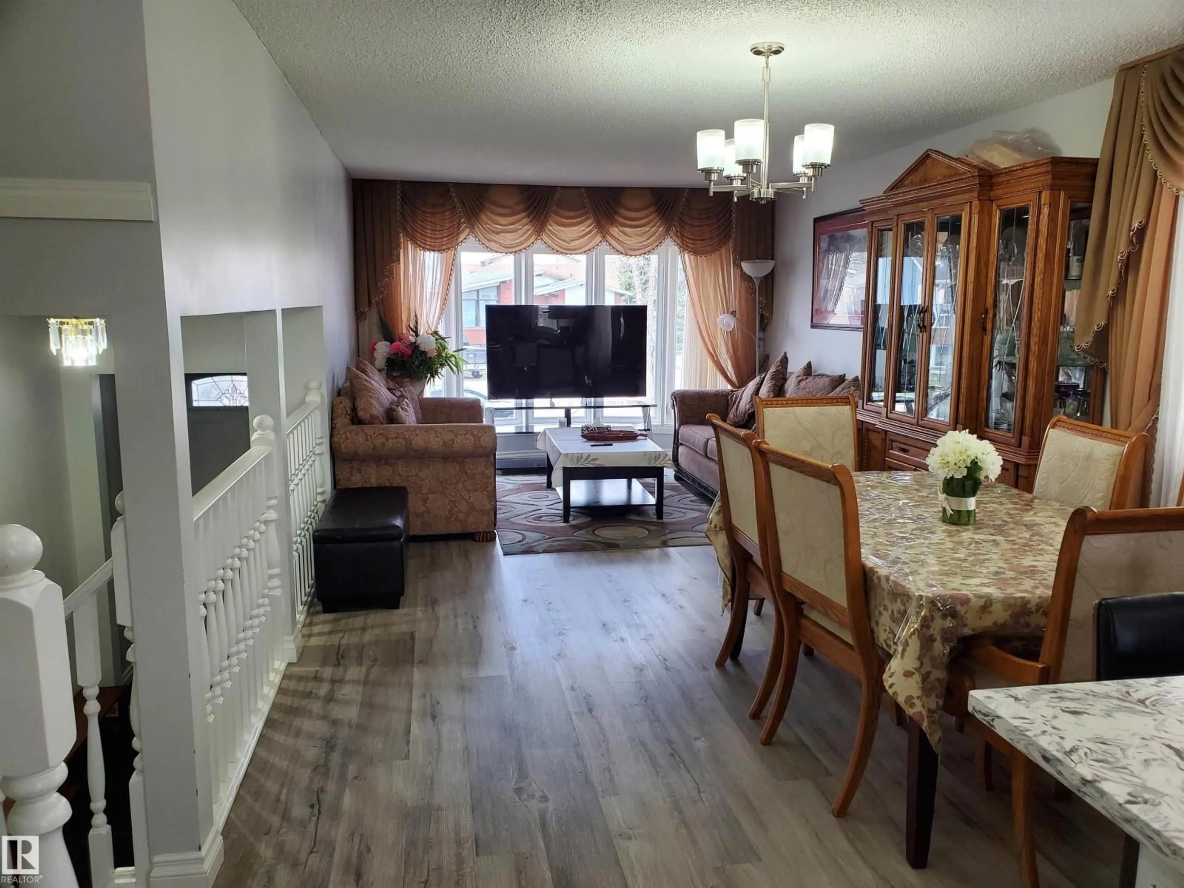 Living room with furniture, wood/laminate floor for NW - 8507 152B AV, Edmonton Alberta T5E5V7