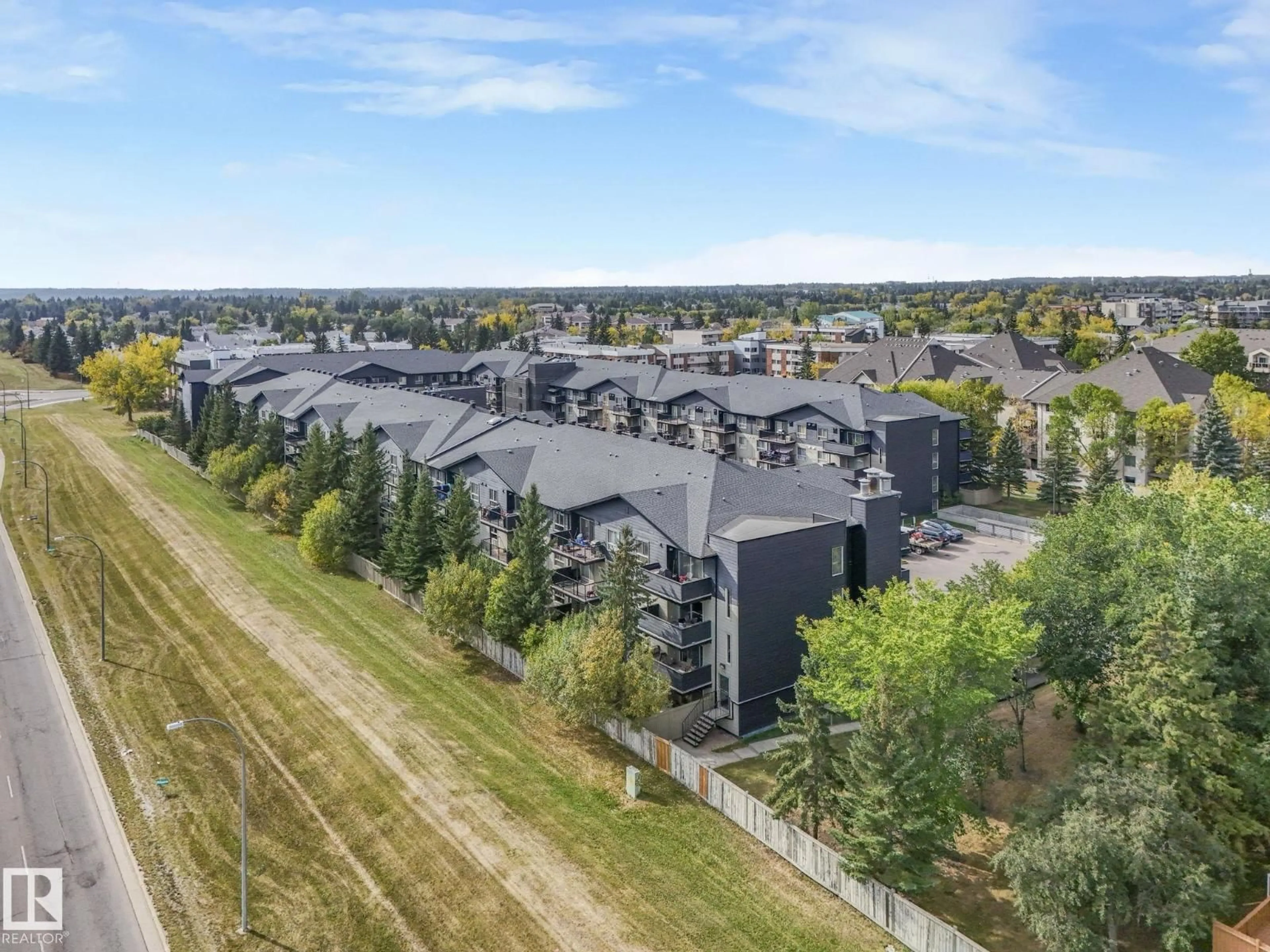 A pic from outside/outdoor area/front of a property/back of a property/a pic from drone, mountain view for #421 - 17003 67 AV, Edmonton Alberta T5T6Y5