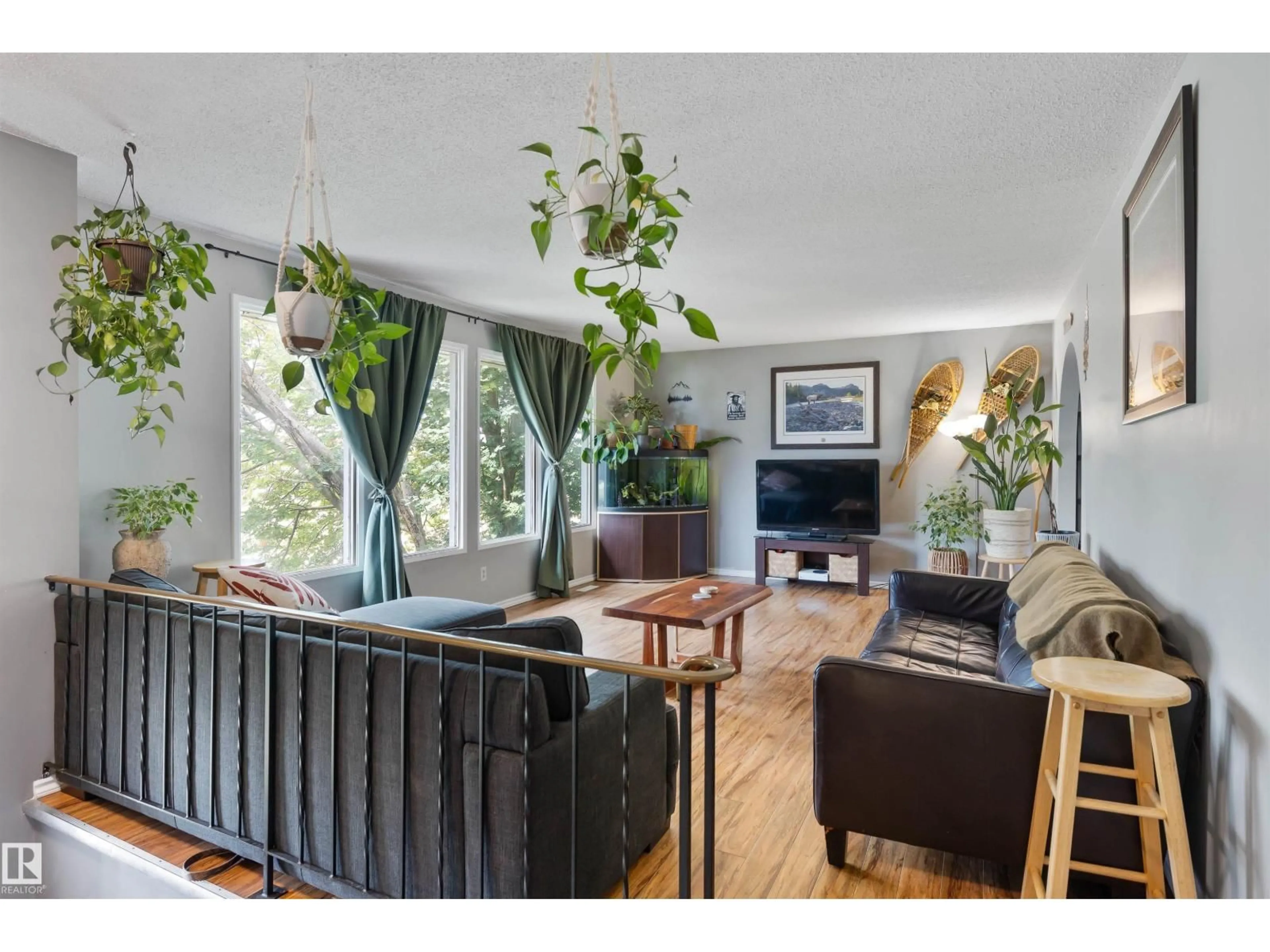 Living room with furniture, wood/laminate floor for 4728 44 AV, Gibbons Alberta T0A1N0