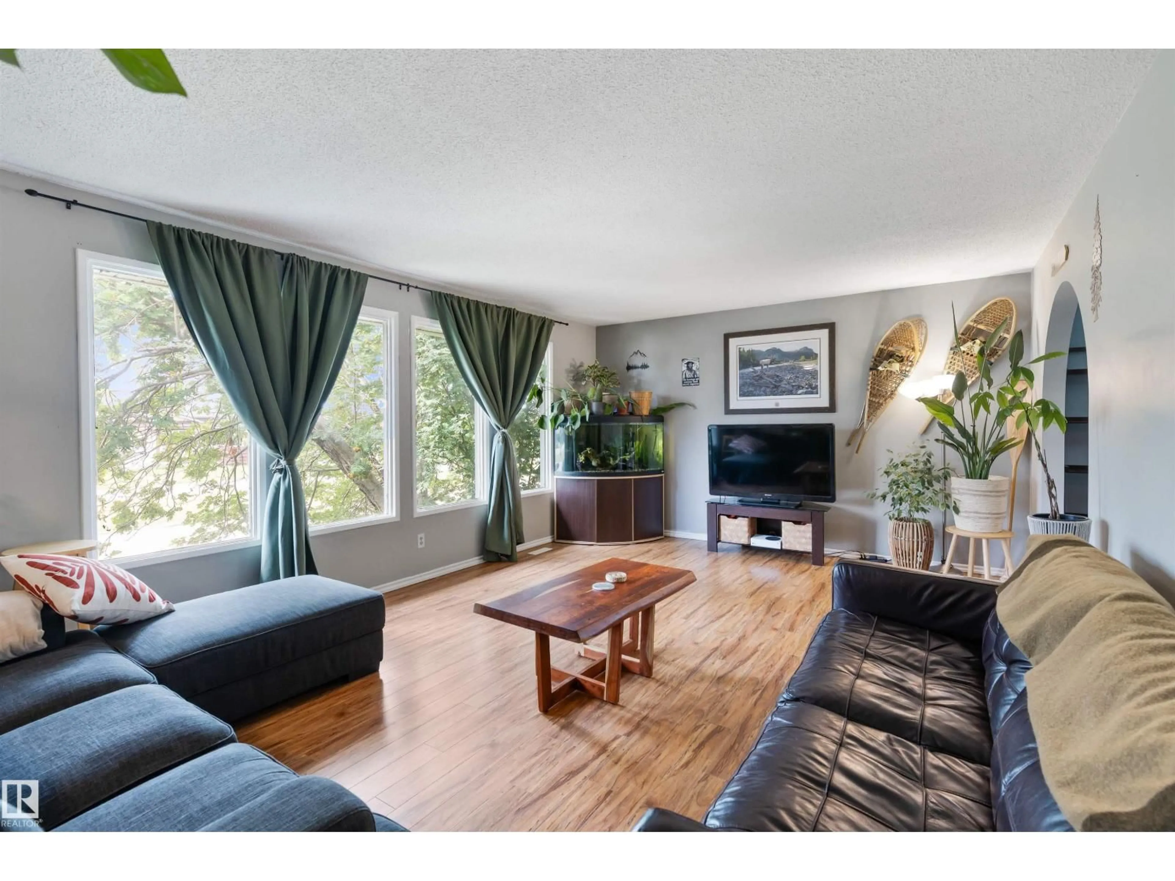 Living room with furniture, wood/laminate floor for 4728 44 AV, Gibbons Alberta T0A1N0