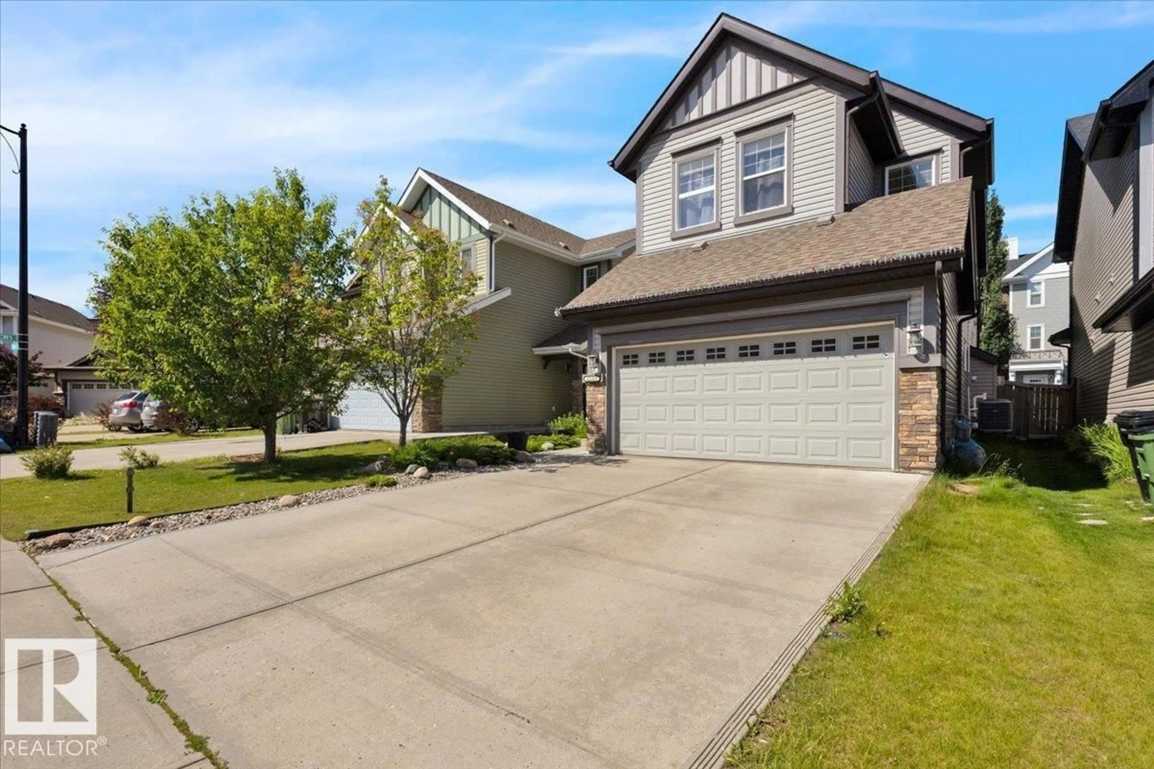 Home with vinyl exterior material, street for 2585 COLE CR, Edmonton Alberta T6W2A3