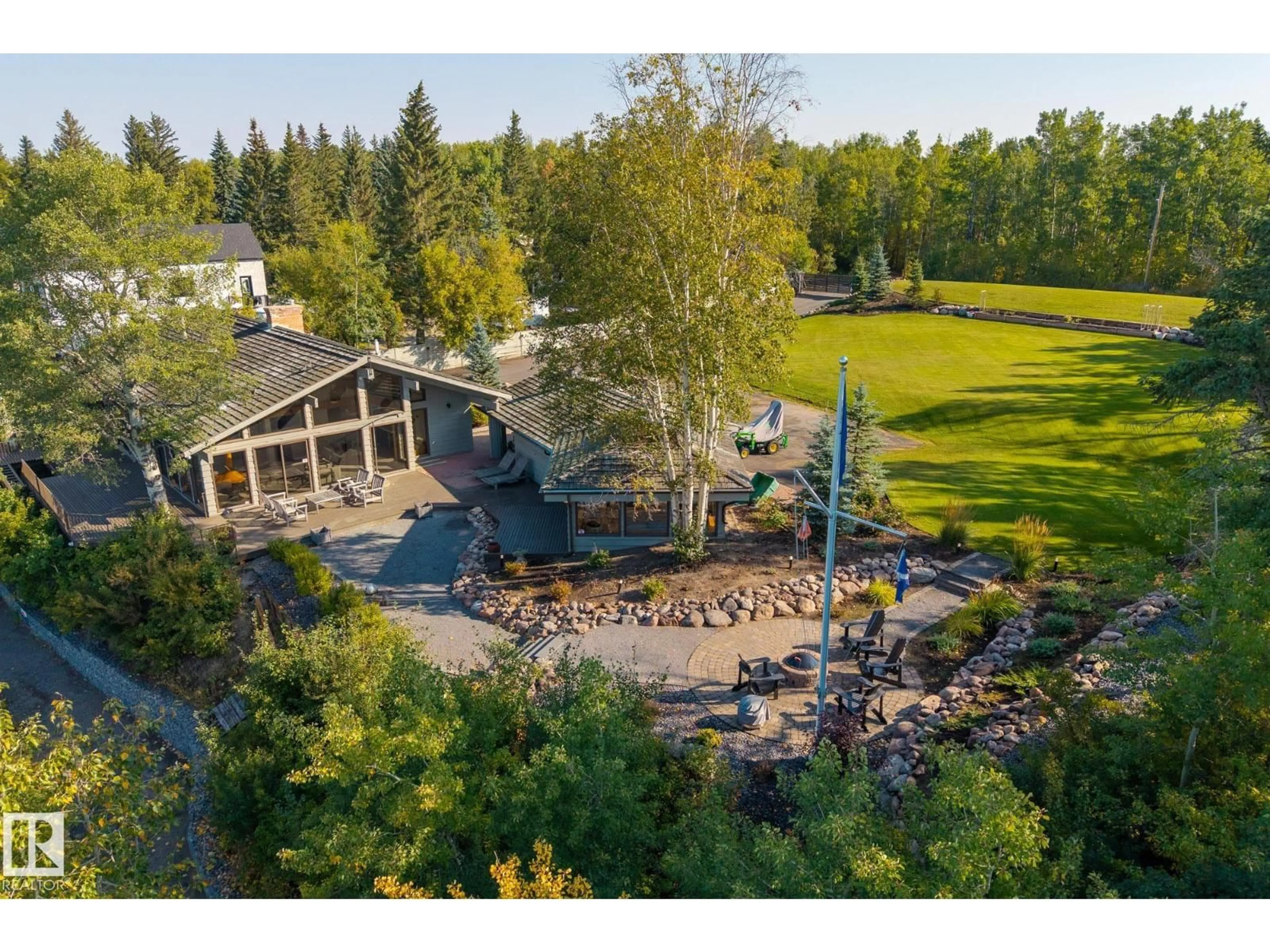 A pic from outside/outdoor area/front of a property/back of a property/a pic from drone, water/lake/river/ocean view for 139 SILVER BE, Rural Wetaskiwin County Alberta T0C2C0