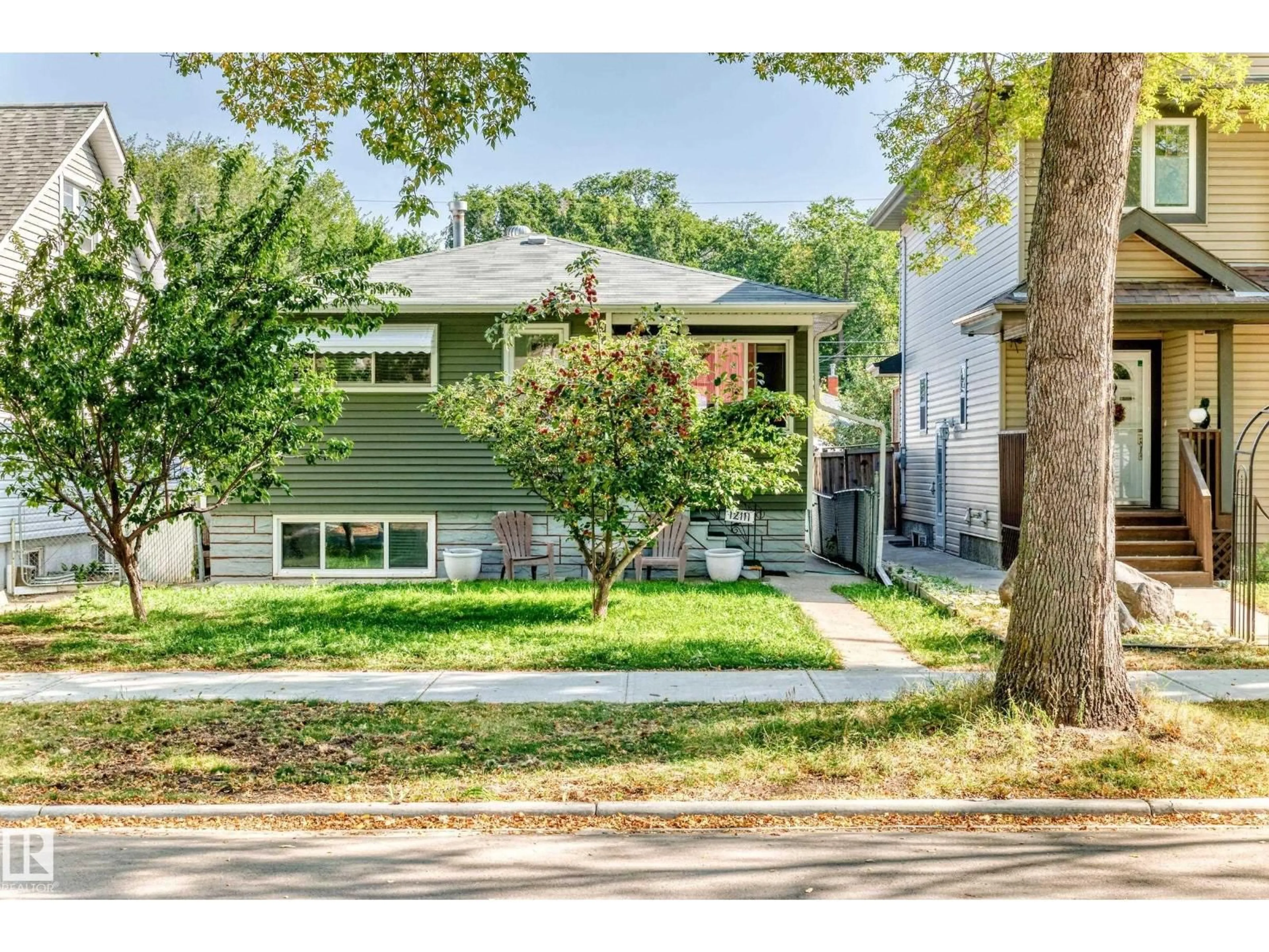 Home with vinyl exterior material, street for NW - 12111 92 ST, Edmonton Alberta T5G1B1