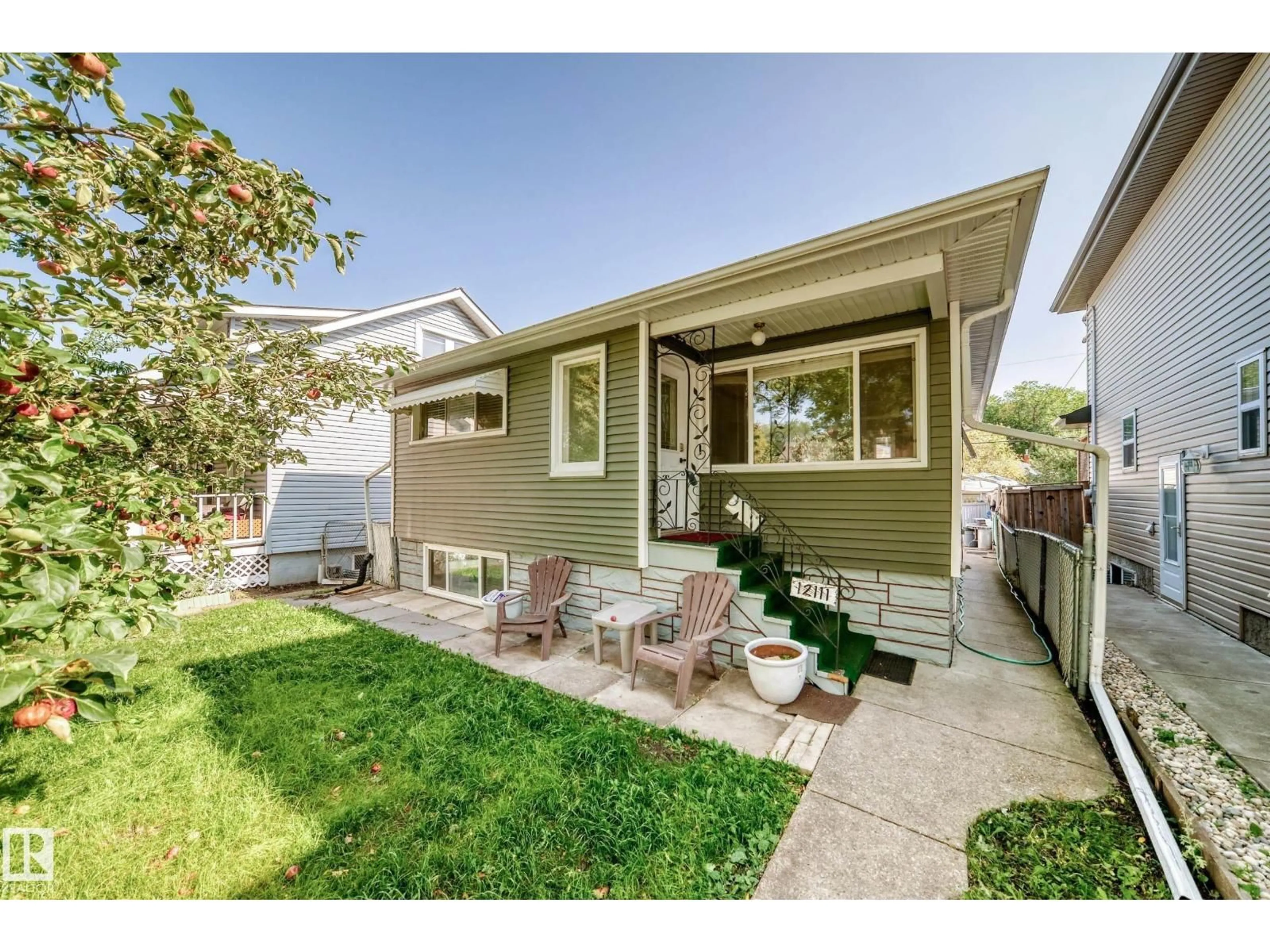 Home with vinyl exterior material, street for NW - 12111 92 ST, Edmonton Alberta T5G1B1