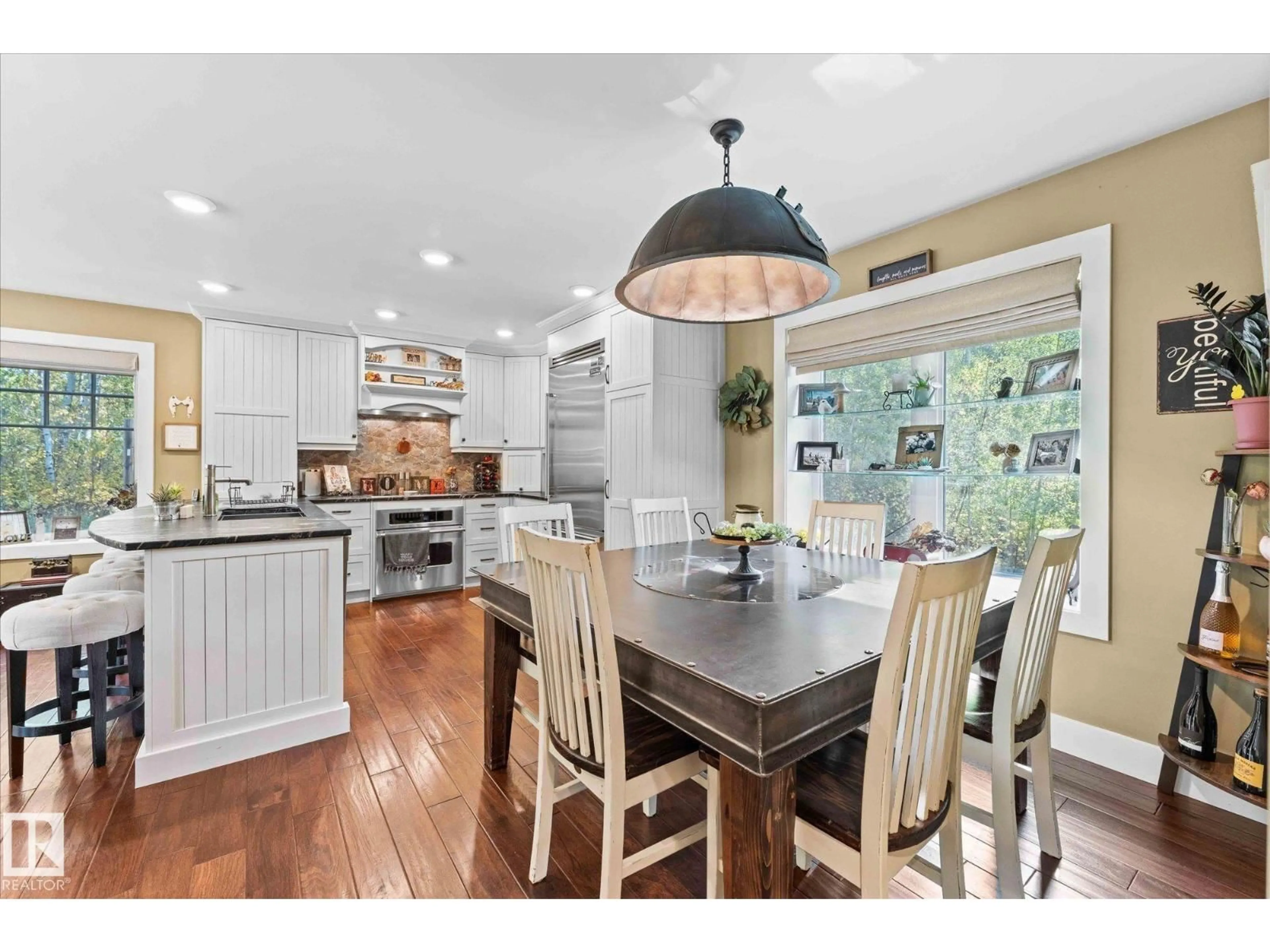 Open concept kitchen, wood/laminate floor for 13 - 54029 RGE ROAD 275, Rural Parkland County Alberta T7X3S6