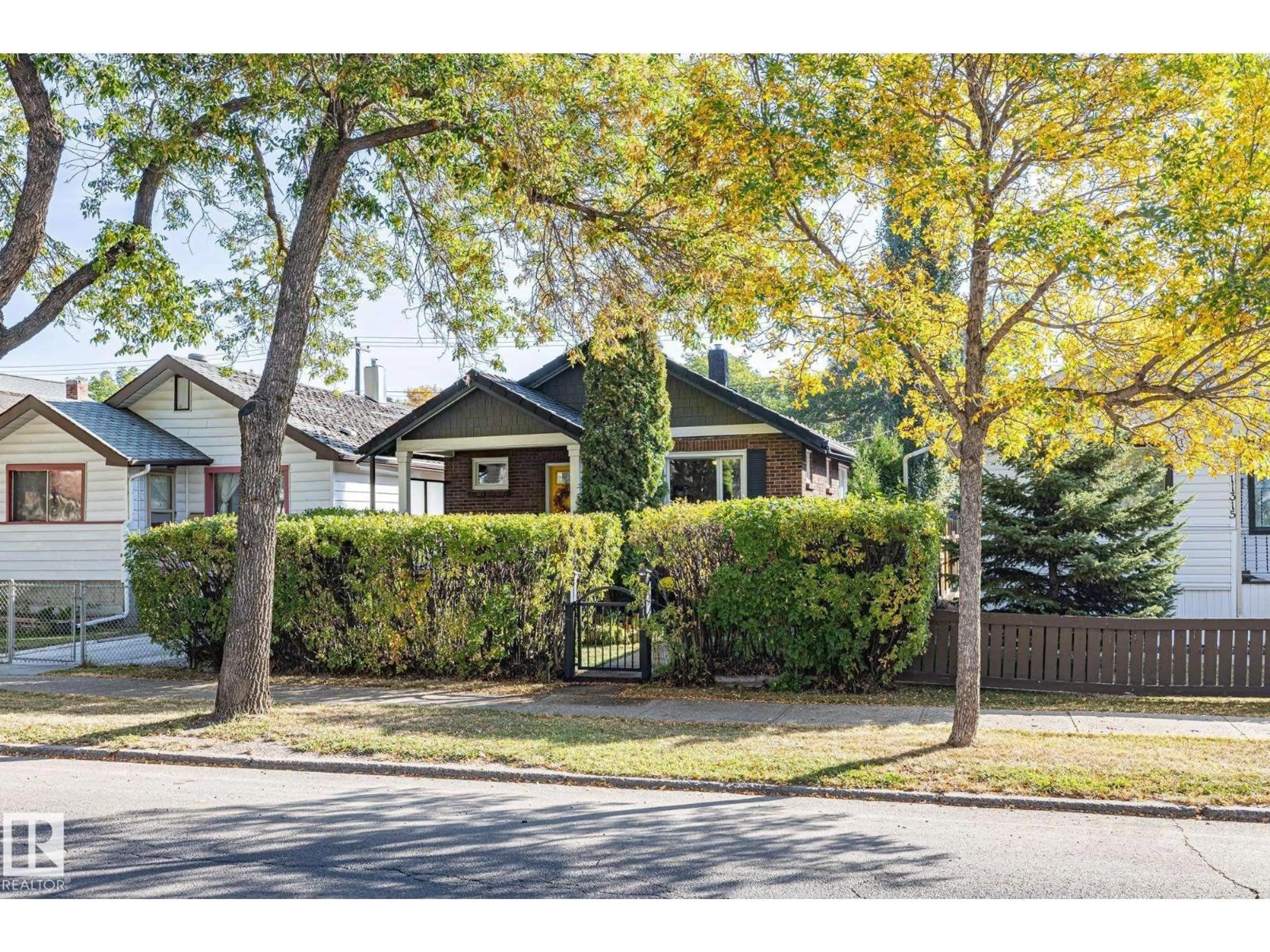 Home with brick exterior material, street for 11317 97 ST, Edmonton Alberta T5G1X3