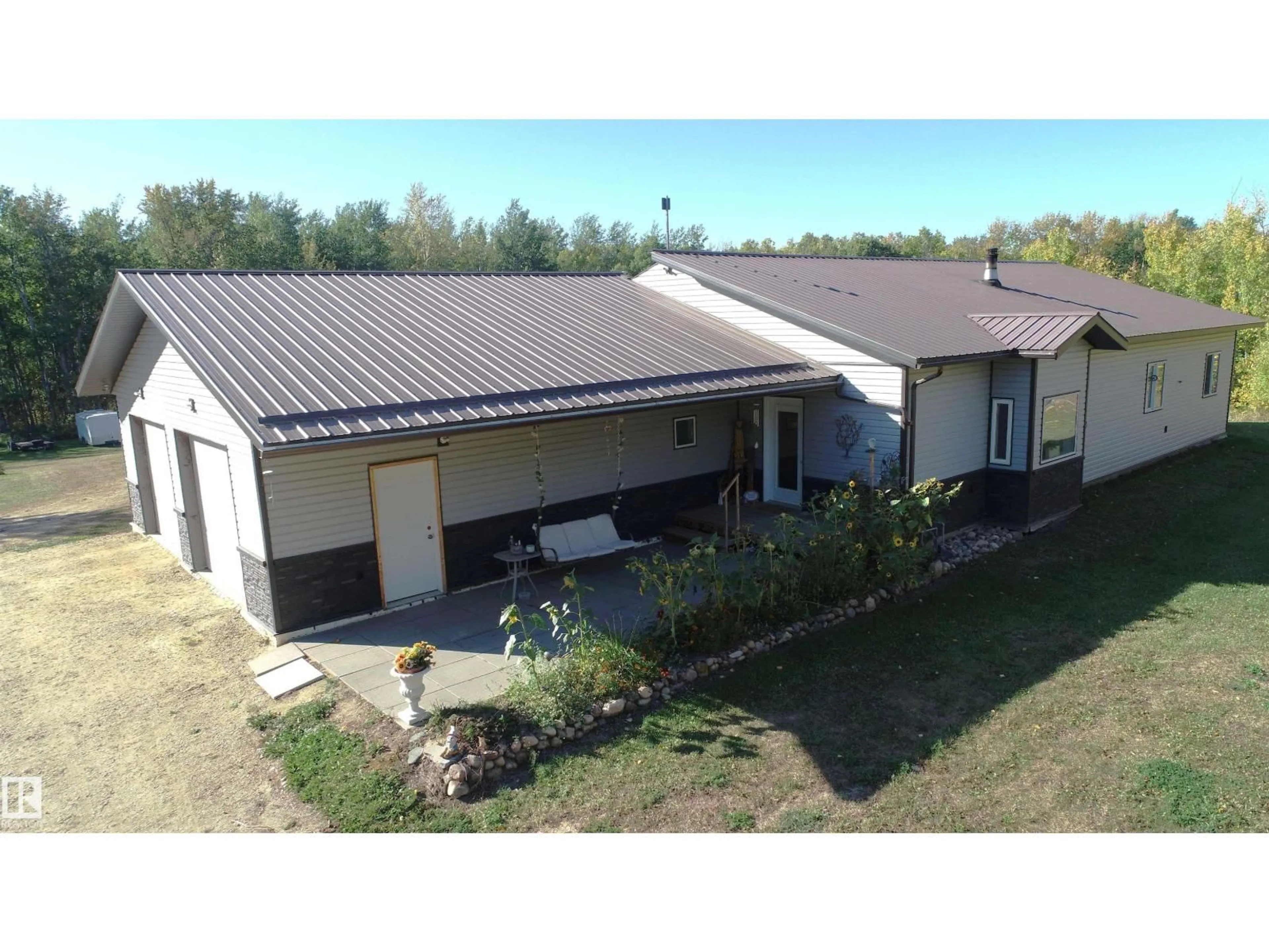 A pic from outside/outdoor area/front of a property/back of a property/a pic from drone, building for 207 - 55108 RGE ROAD 15, Rural Lac Ste. Anne County Alberta T0E1V0