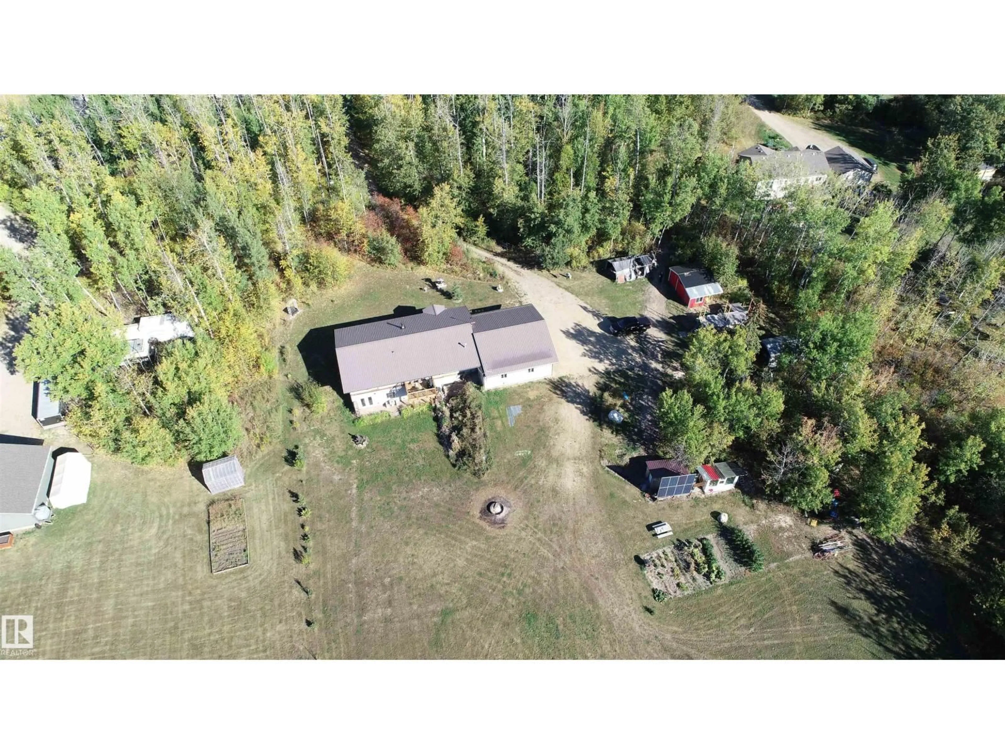A pic from outside/outdoor area/front of a property/back of a property/a pic from drone, forest/trees view for 207 - 55108 RGE ROAD 15, Rural Lac Ste. Anne County Alberta T0E1V0