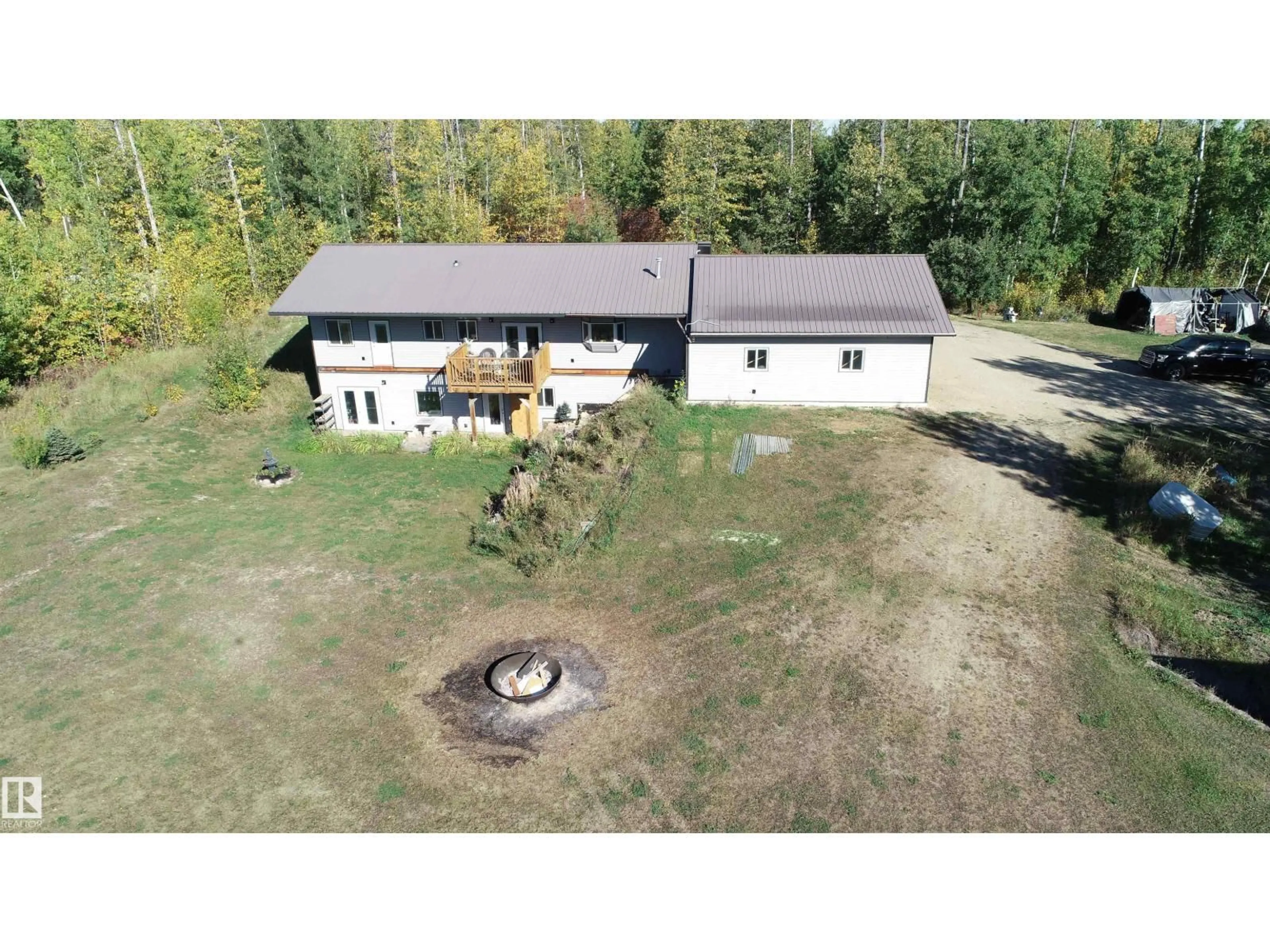 A pic from outside/outdoor area/front of a property/back of a property/a pic from drone, building for 207 - 55108 RGE ROAD 15, Rural Lac Ste. Anne County Alberta T0E1V0