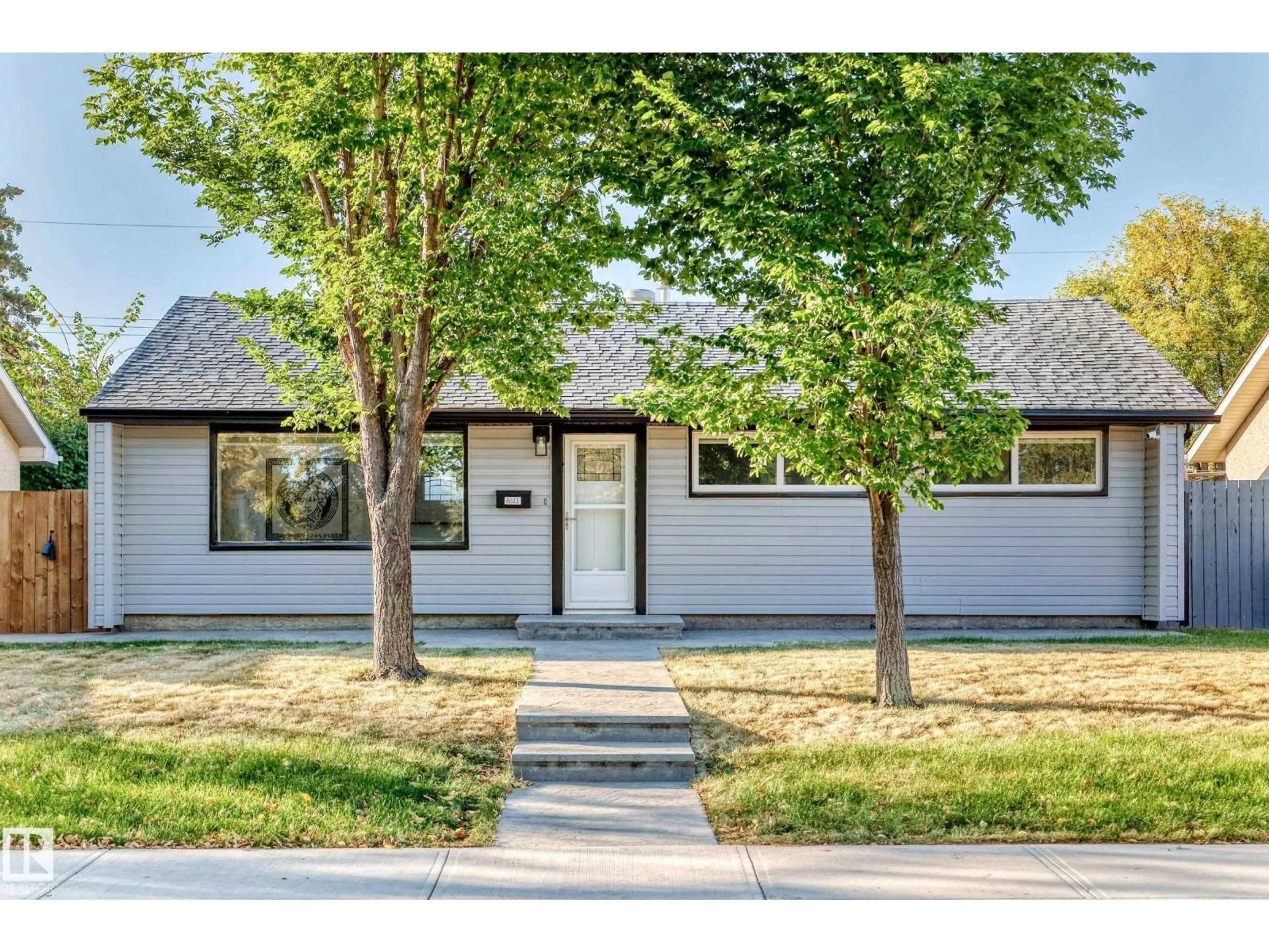 Home with vinyl exterior material, street for 8811 130A AV, Edmonton Alberta T5E0V7