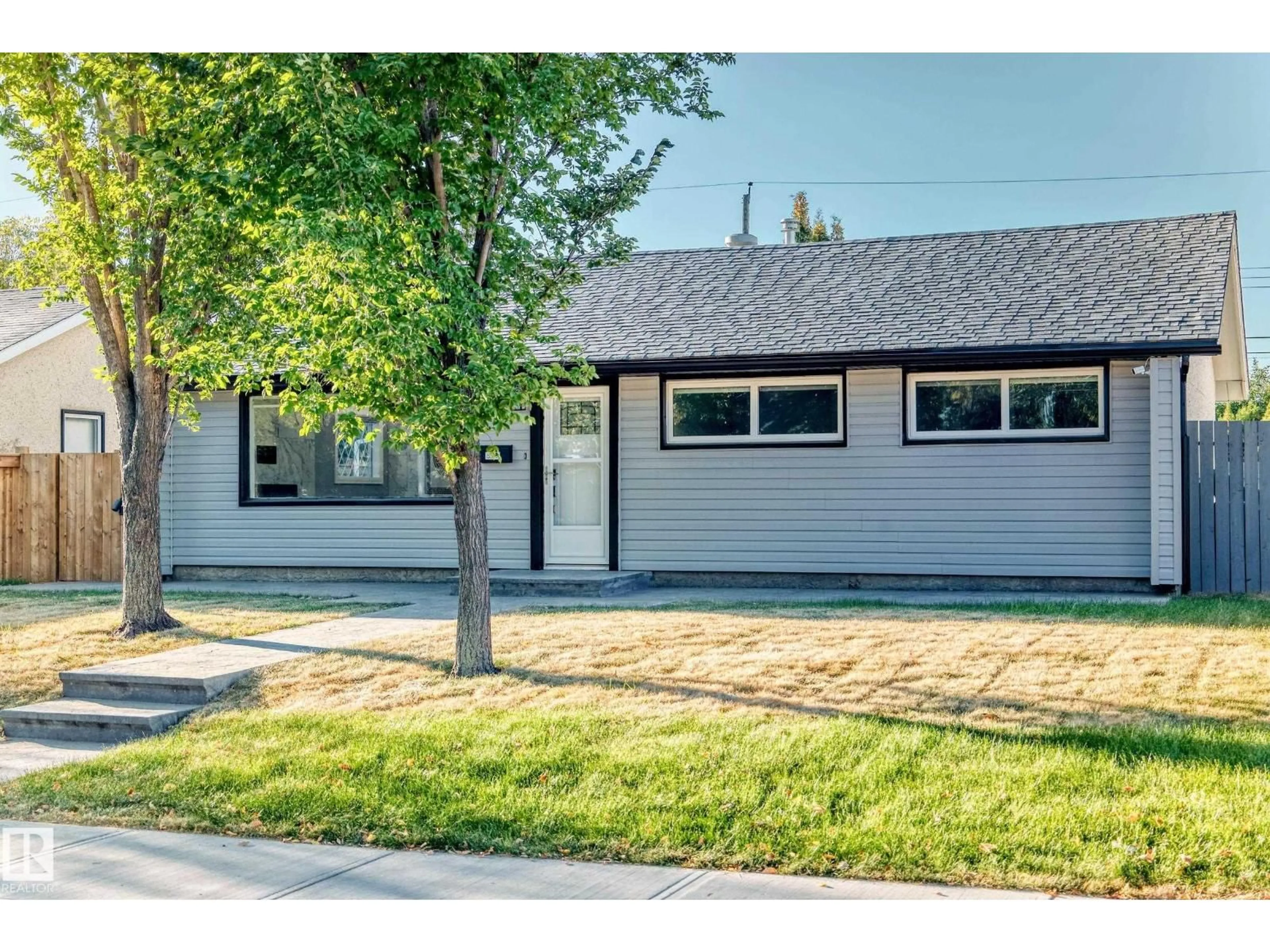 Home with vinyl exterior material, street for 8811 130A AV, Edmonton Alberta T5E0V7