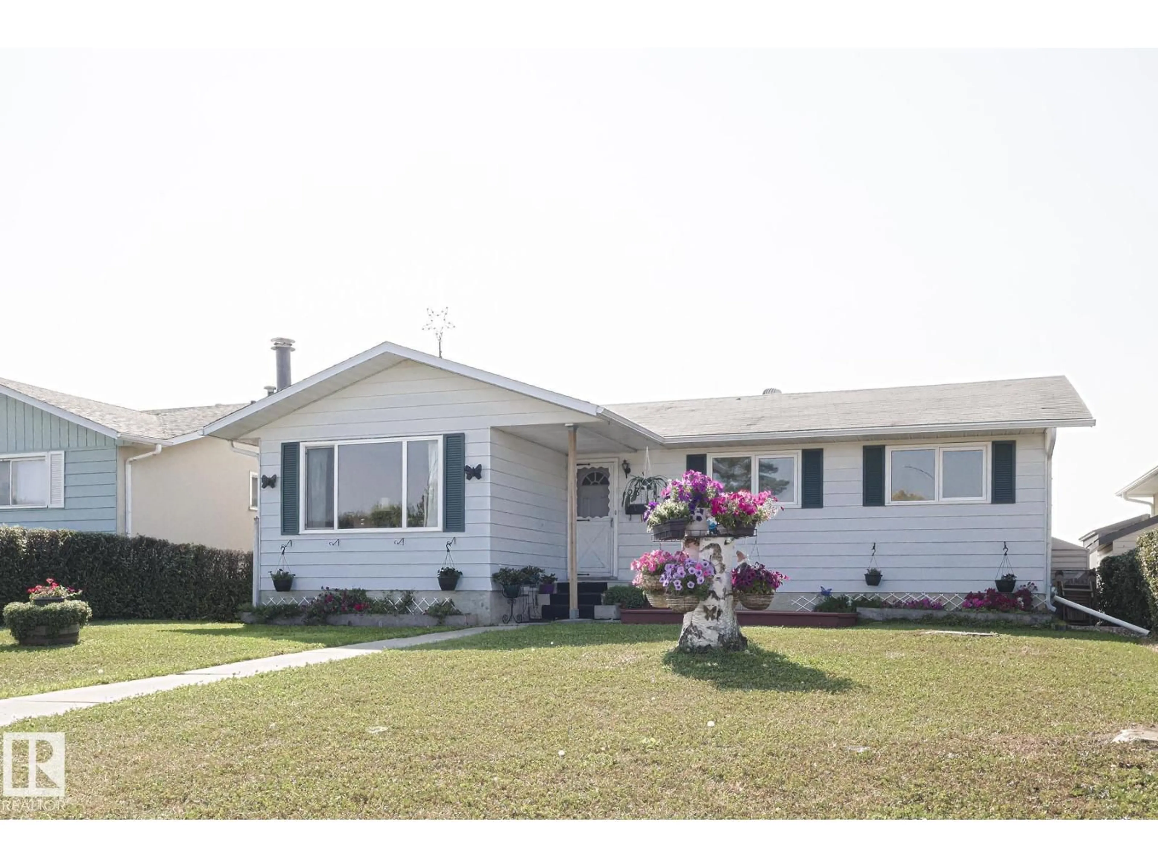 Home with vinyl exterior material, street for 128 CAMELOT AV, Leduc Alberta T9E4L1