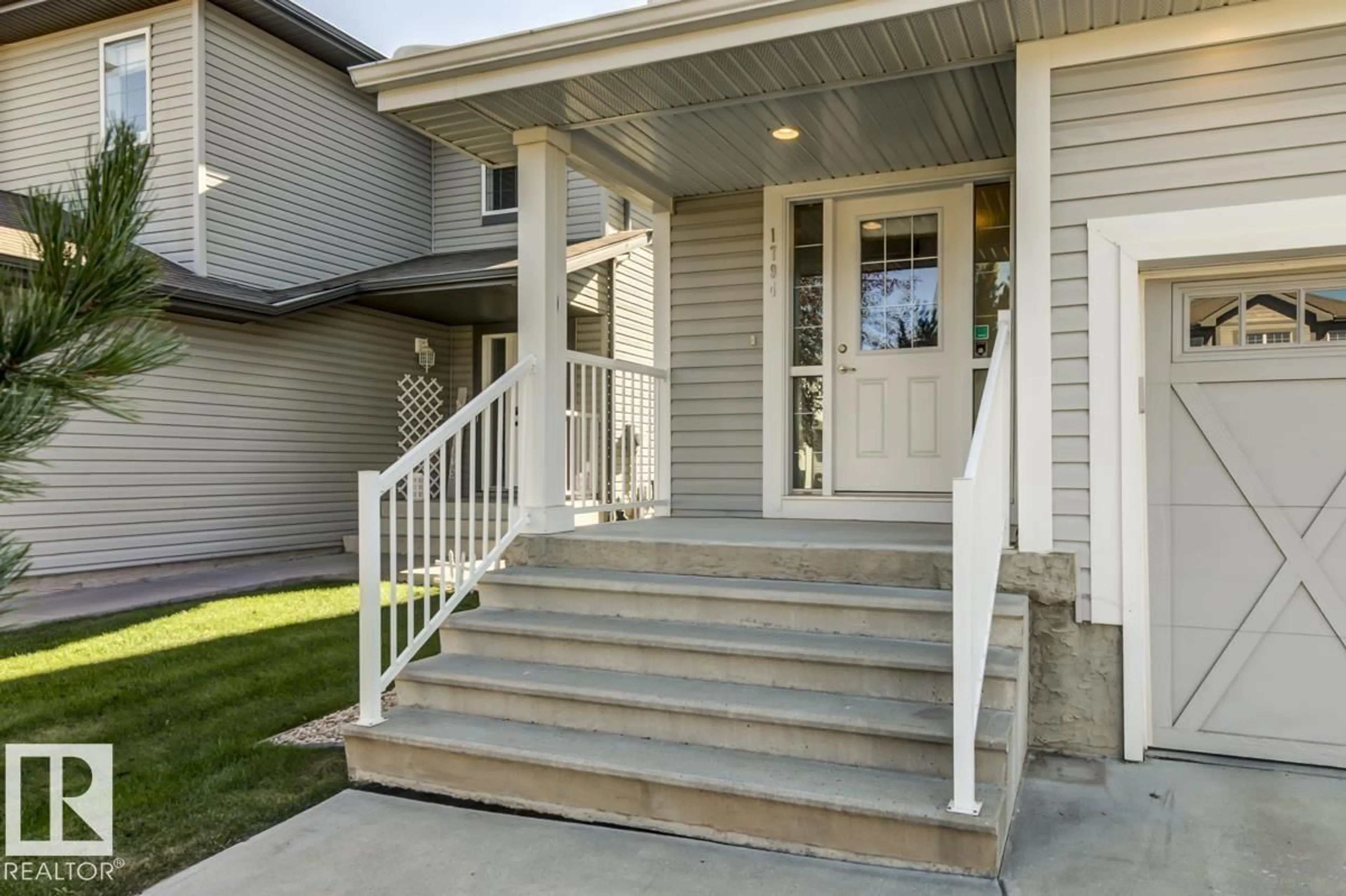 Home with vinyl exterior material, street for 1794 HAMMOND CR, Edmonton Alberta T6M0H9