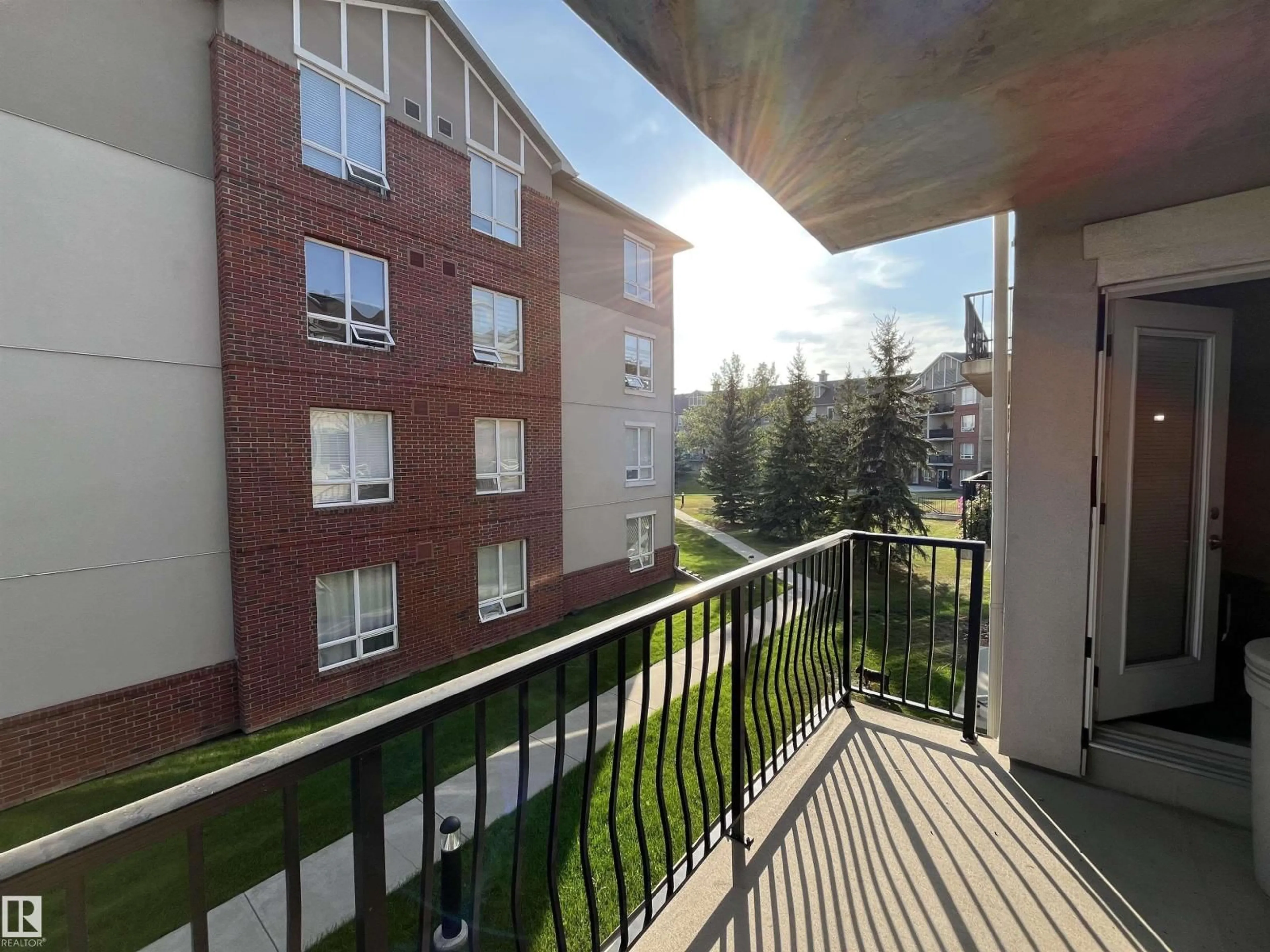 Balcony in the apartment, city buildings view from balcony for #211 - 6315 135 AV, Edmonton Alberta T5A5J7