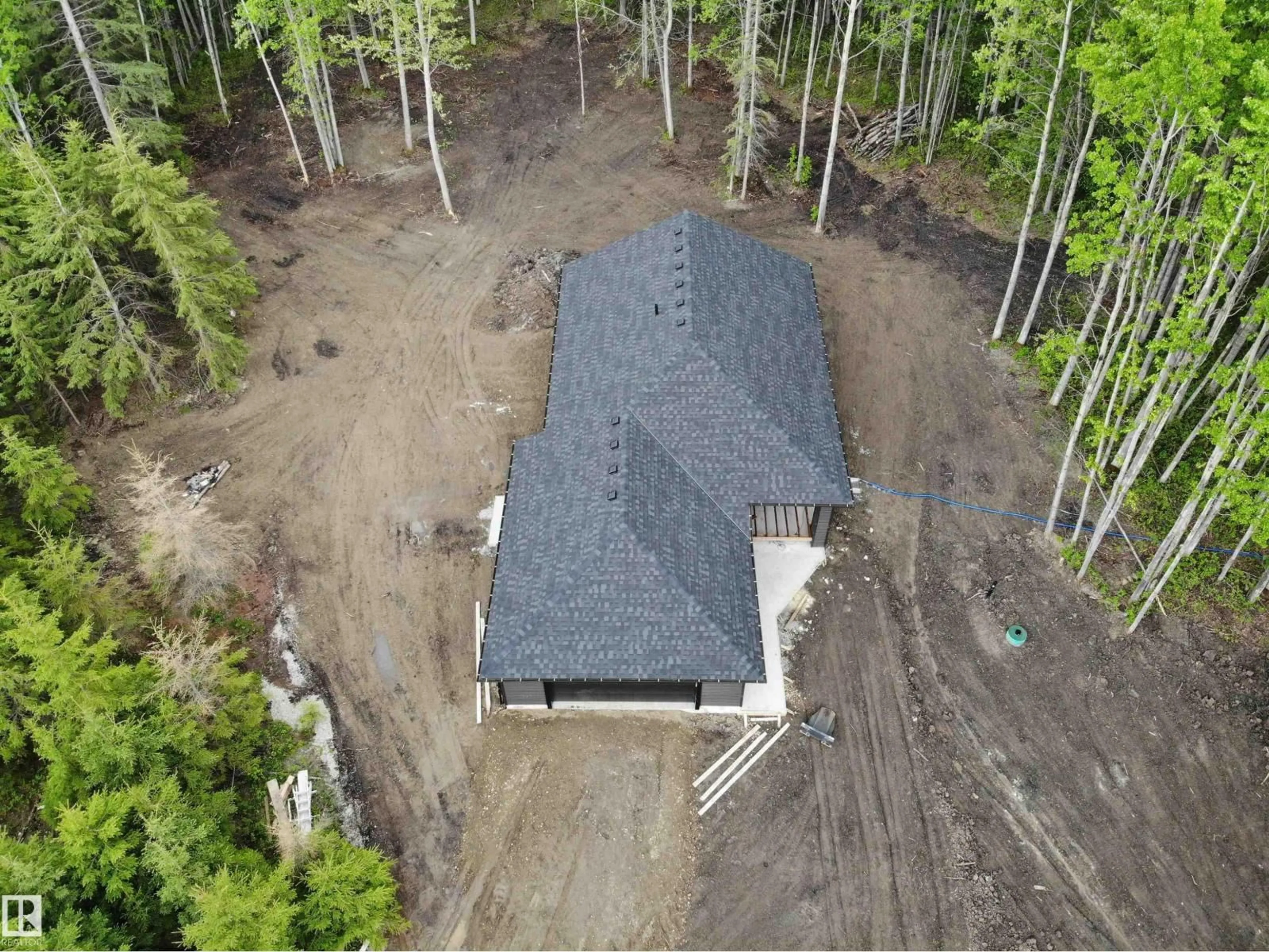 A pic from outside/outdoor area/front of a property/back of a property/a pic from drone, forest/trees view for 37 - 420 1414 HWY, Rural Lac Ste. Anne County Alberta T5A1H3