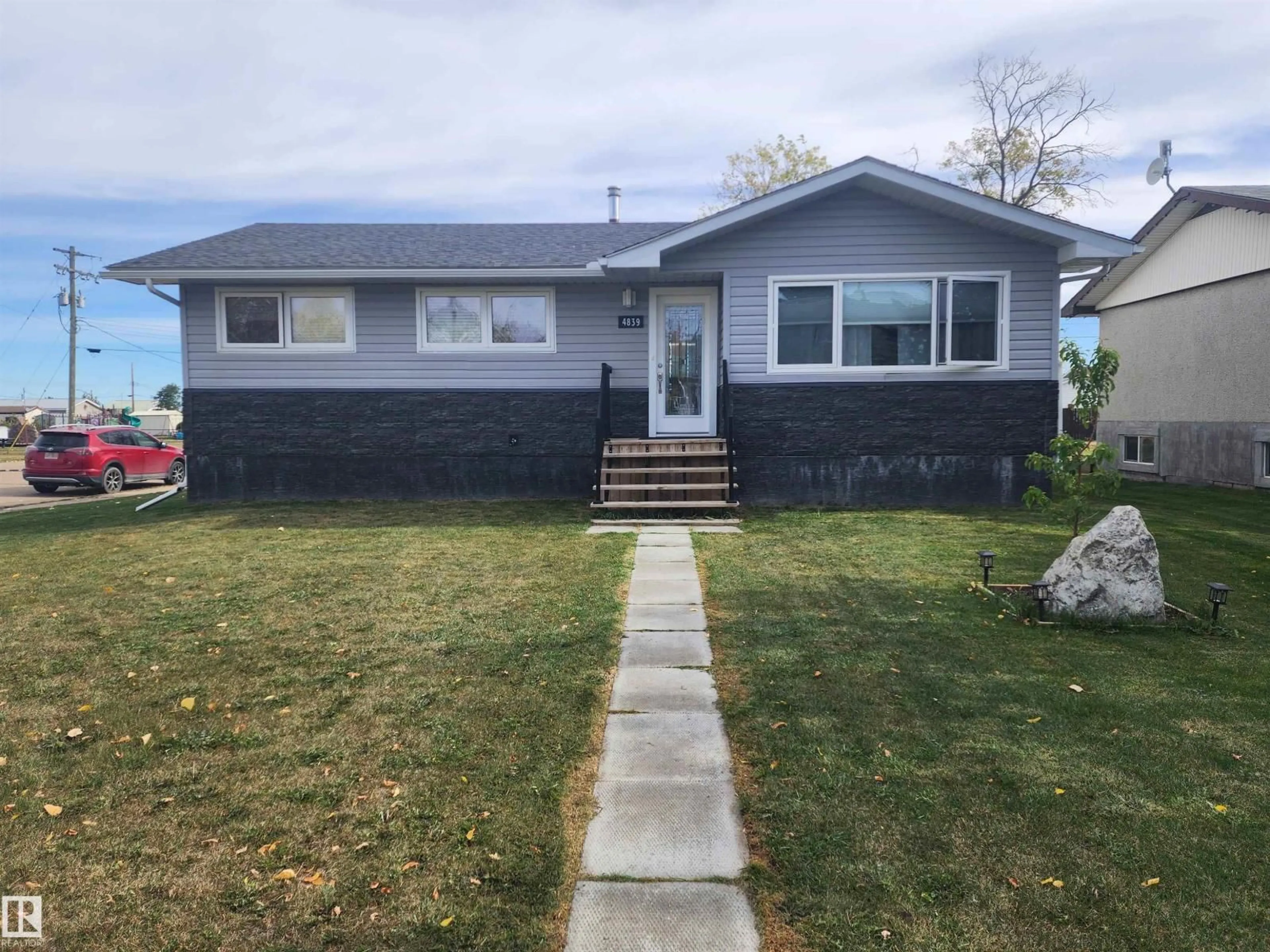 Home with vinyl exterior material, street for 4839 49 ST, Clyde Alberta T0G0P0