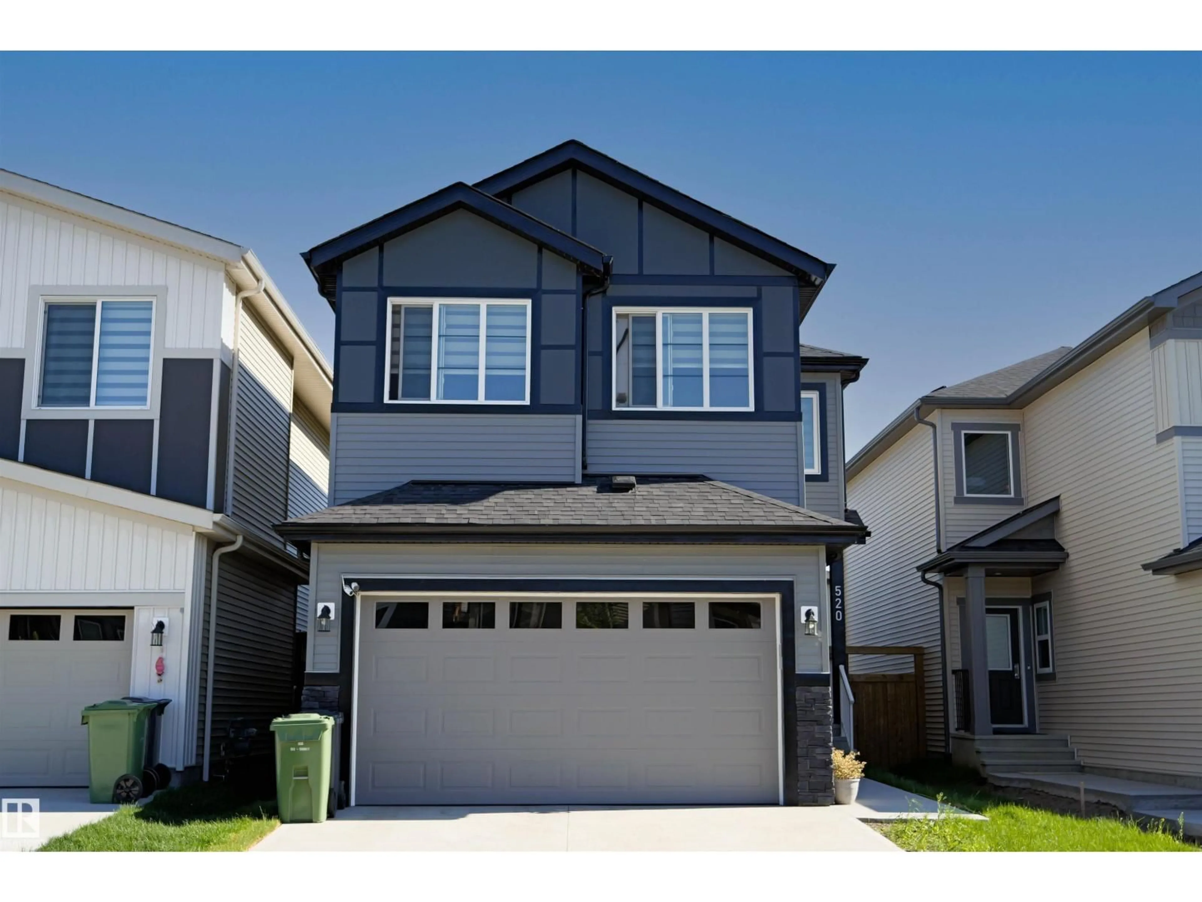 Home with vinyl exterior material, street for 520 BLUFF LN, Leduc Alberta T9E1R5