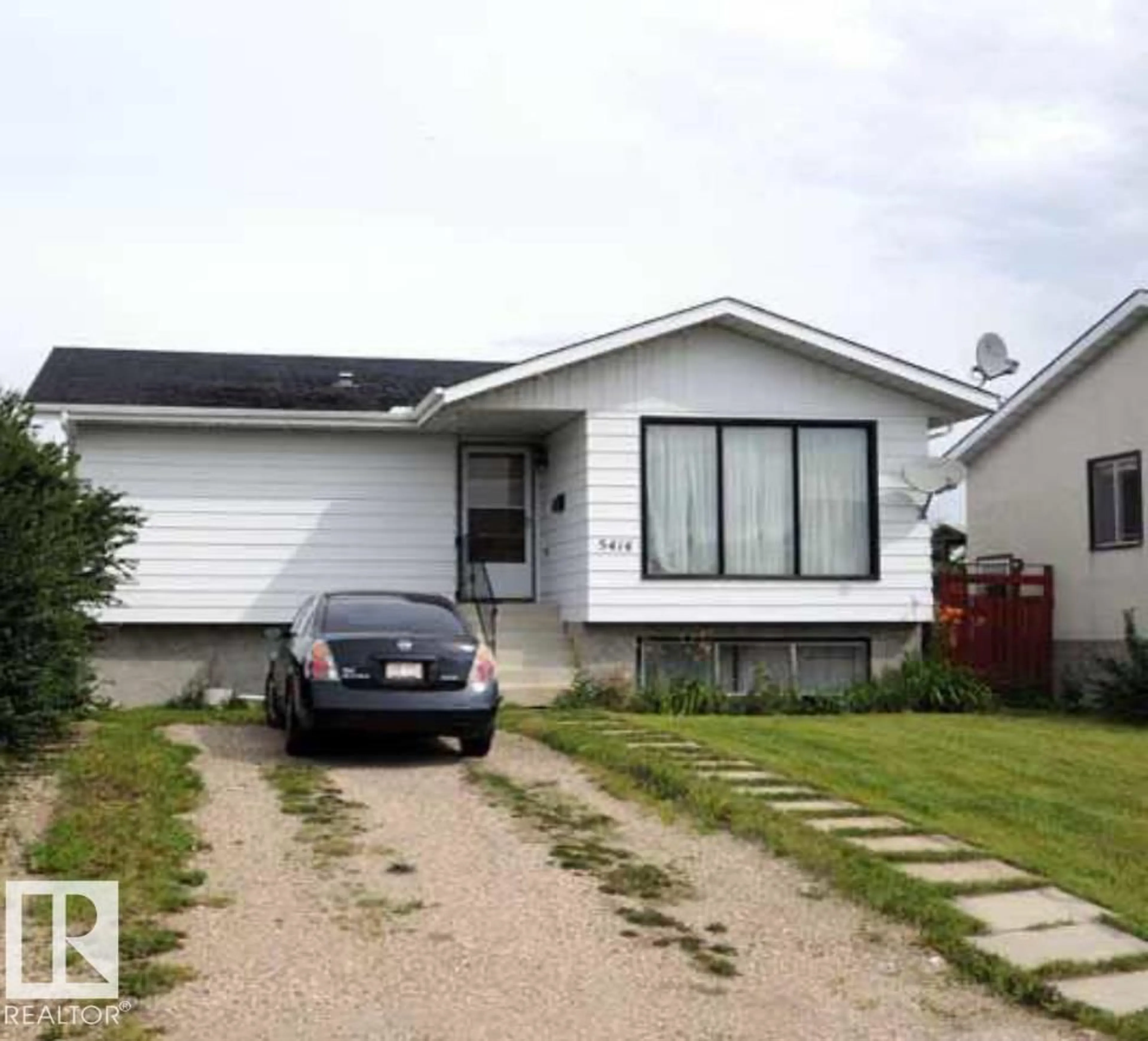 Home with vinyl exterior material, street for NW - 5414 14 A AV, Edmonton Alberta T6L2B6