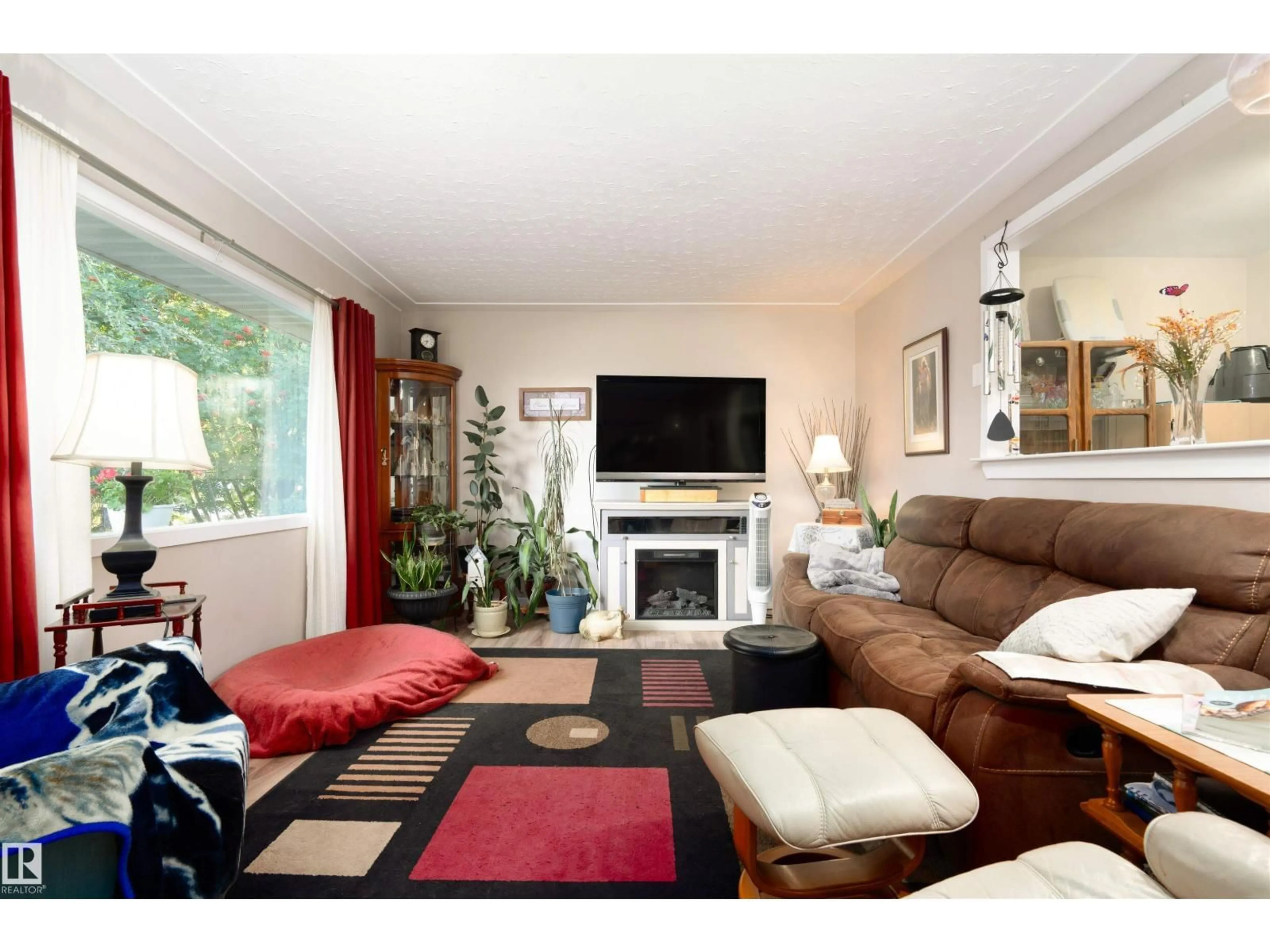 Living room with furniture, wood/laminate floor for 10324 136 AV, Edmonton Alberta T5E1W1