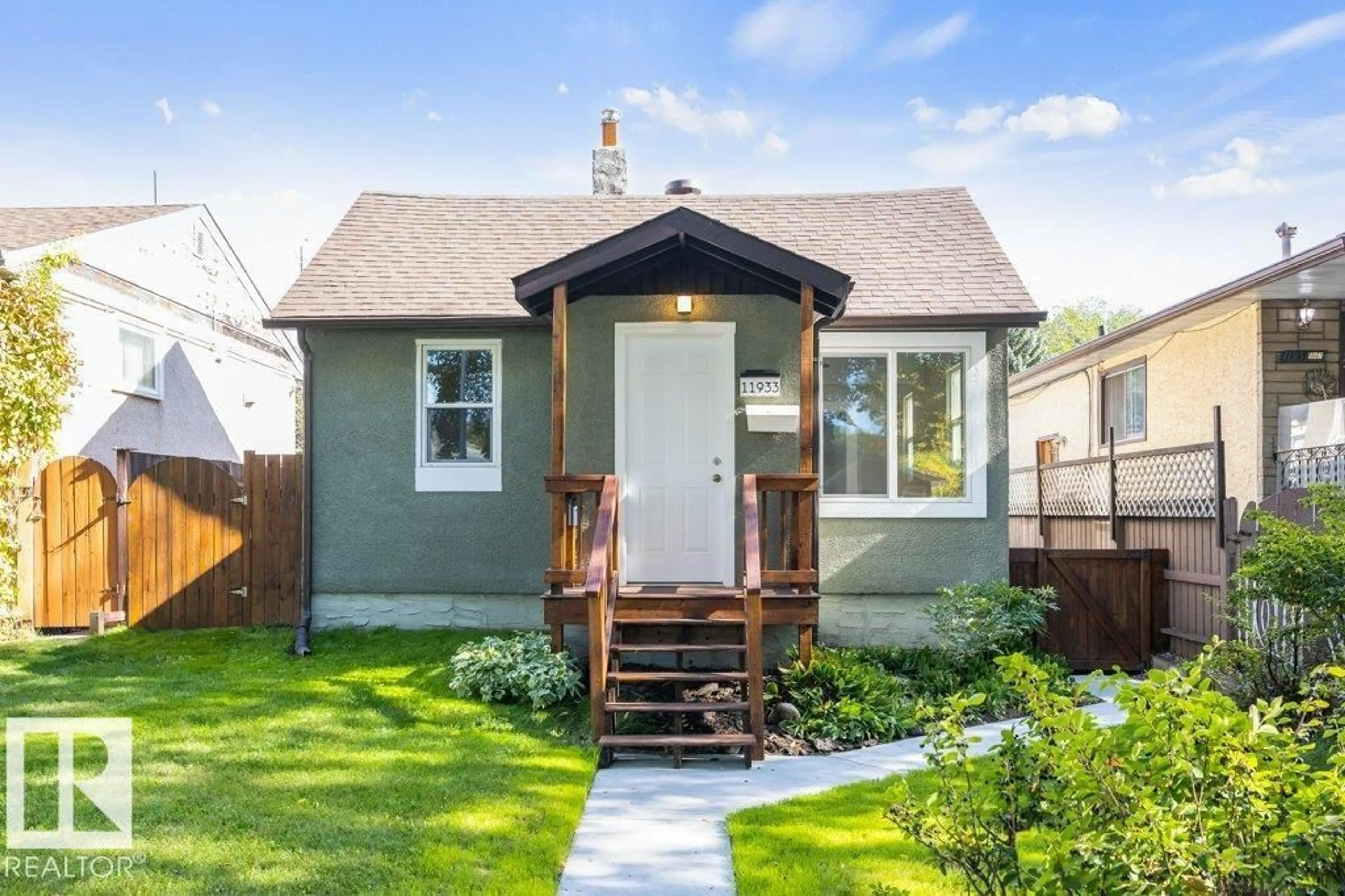 Home with vinyl exterior material, street for NW - 11933 56 ST, Edmonton Alberta T5W3S8