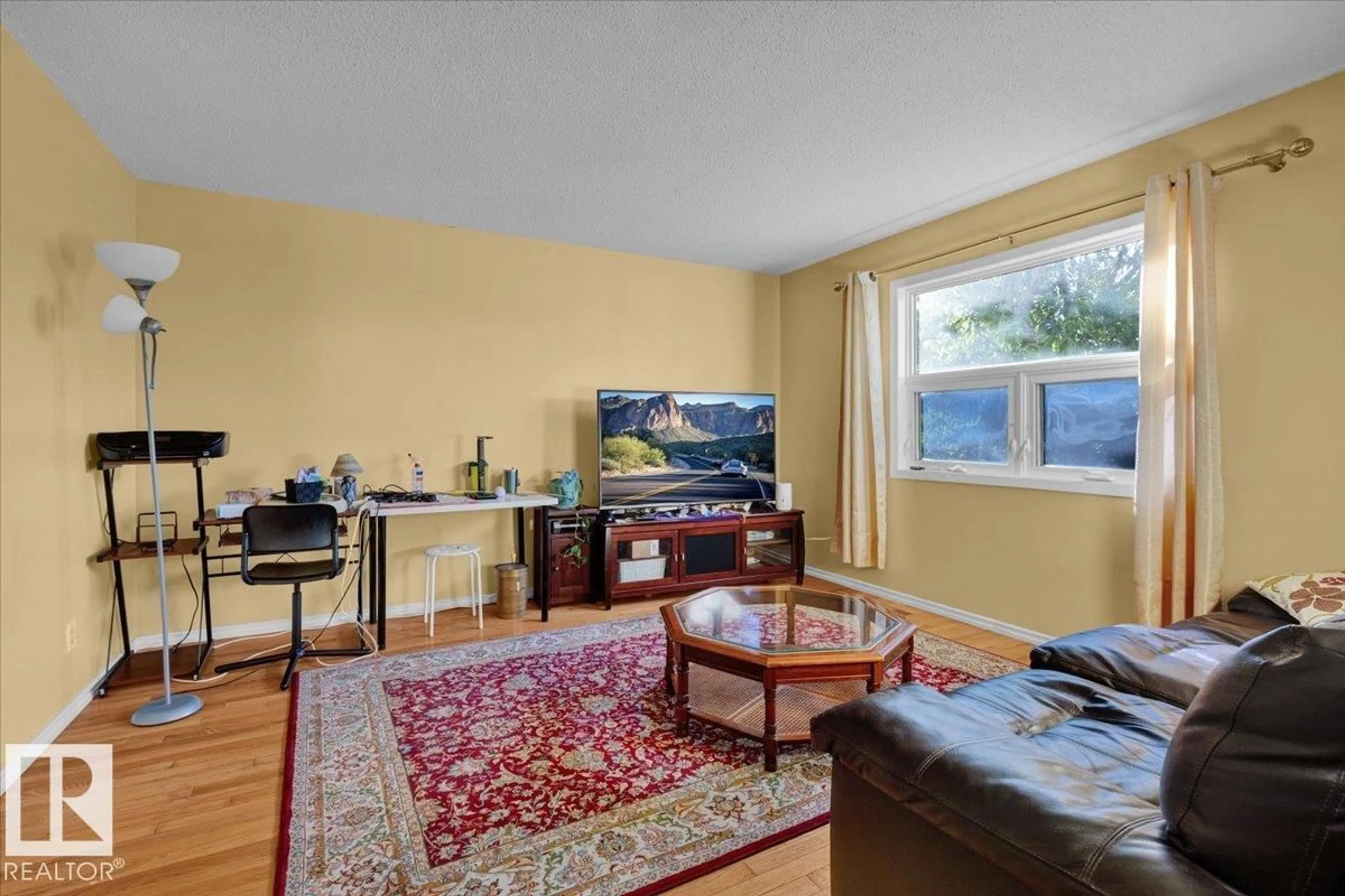 Living room with furniture, unknown for 18708 57 AV, Edmonton Alberta T6M2A4