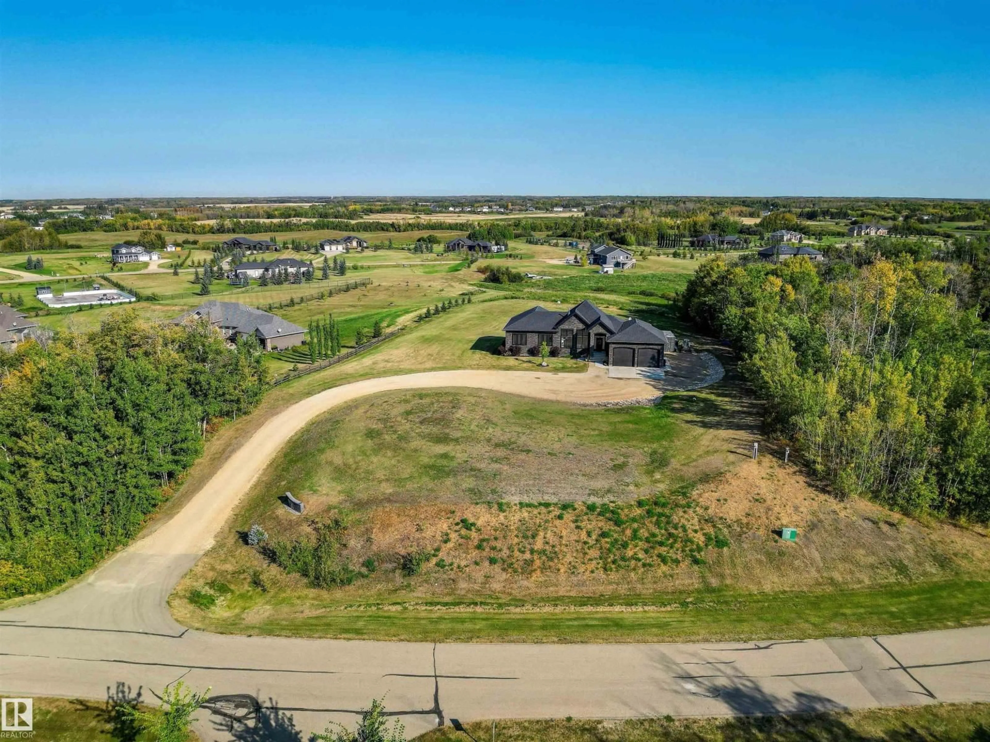 A pic from outside/outdoor area/front of a property/back of a property/a pic from drone, unknown for 100 50054 RGE ROAD 232, Rural Leduc County Alberta T4X0K8