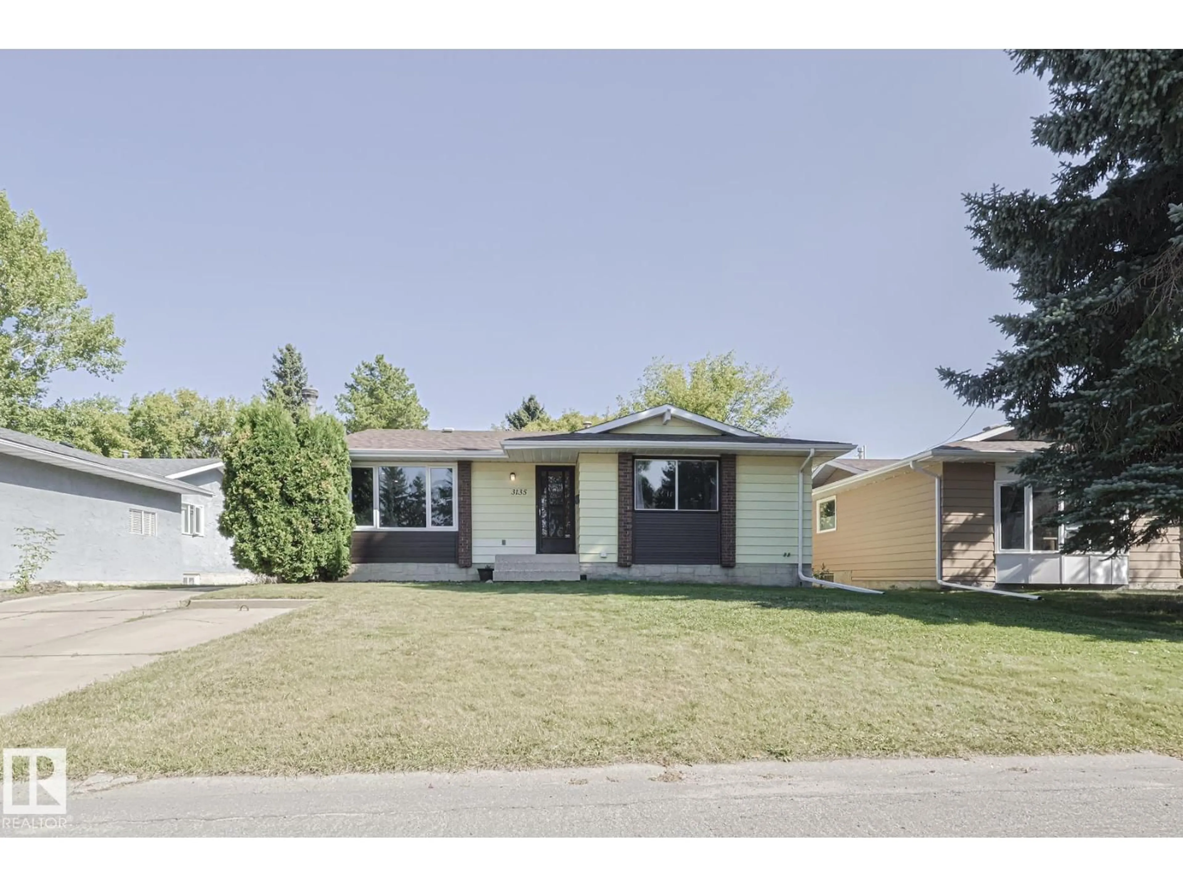 Home with vinyl exterior material, street for 3135 74 ST, Edmonton Alberta T6K1J7