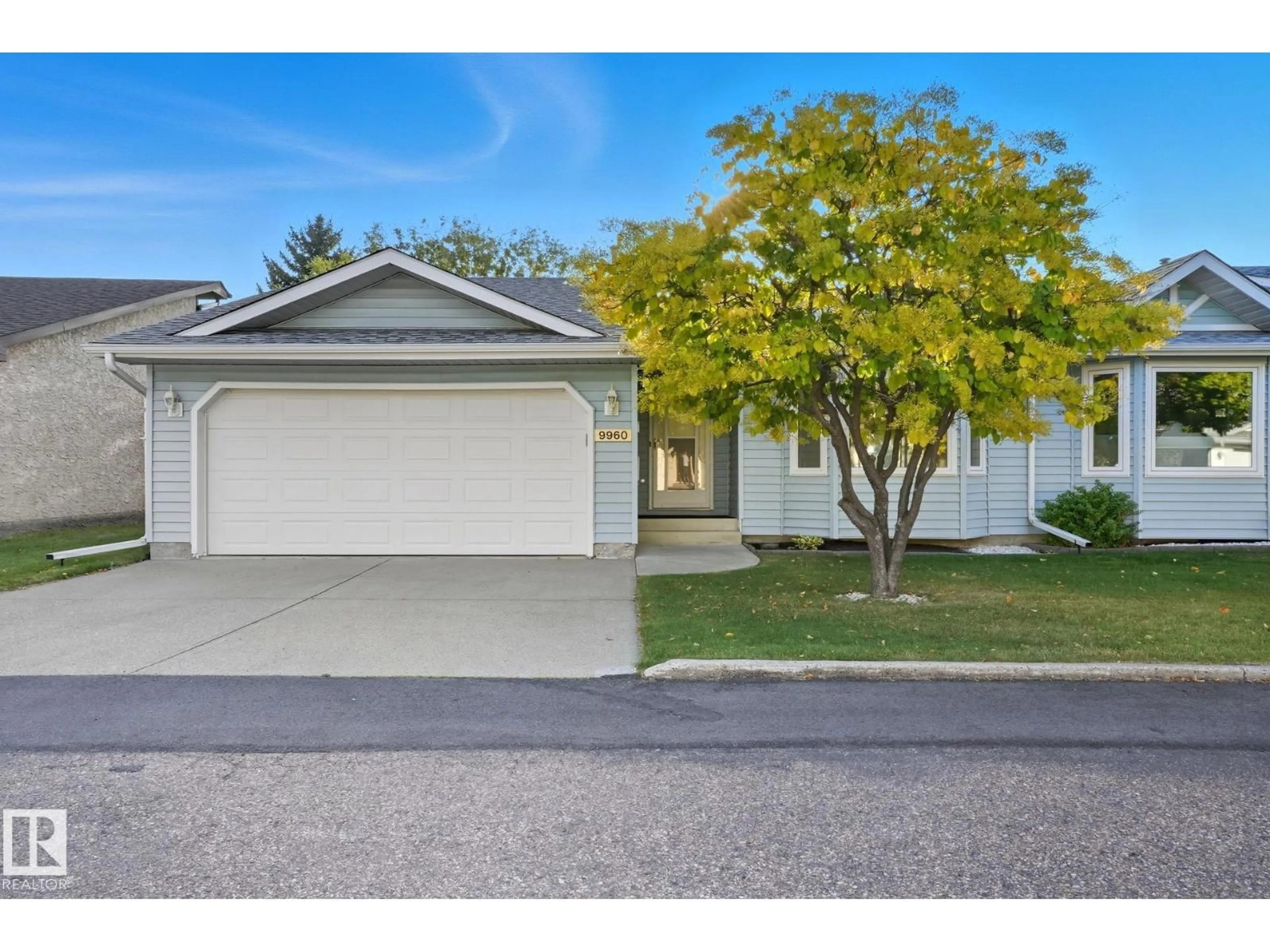 Home with vinyl exterior material, street for NW - 9960 176 AV, Edmonton Alberta T5X5W1