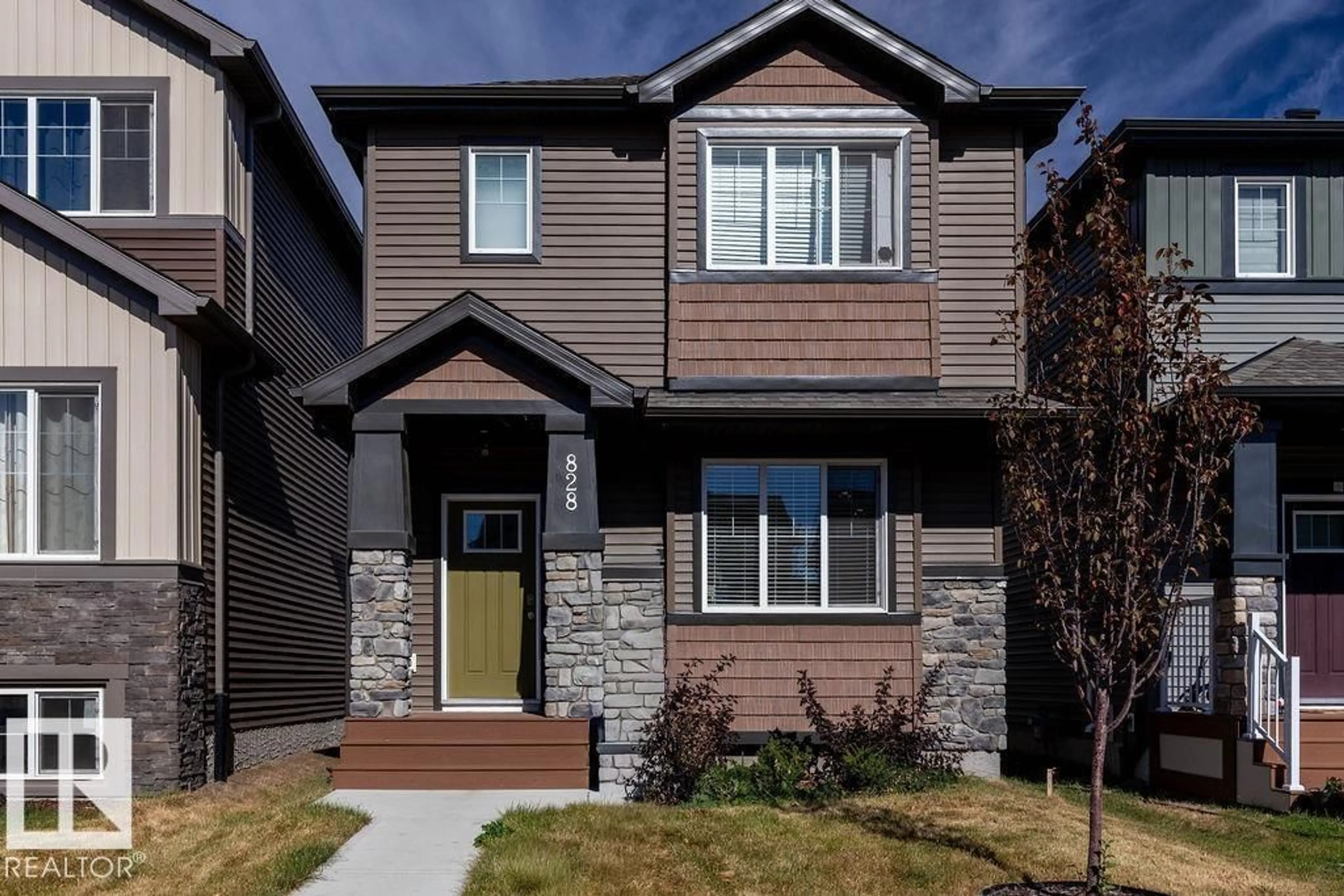 Home with brick exterior material, street for 828 NORTHERN HARRIER LN, Edmonton Alberta T5S0P8